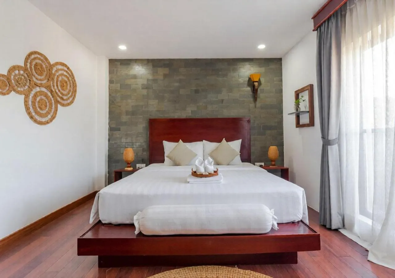 Bed in Angkor Eden Boutique Hotel