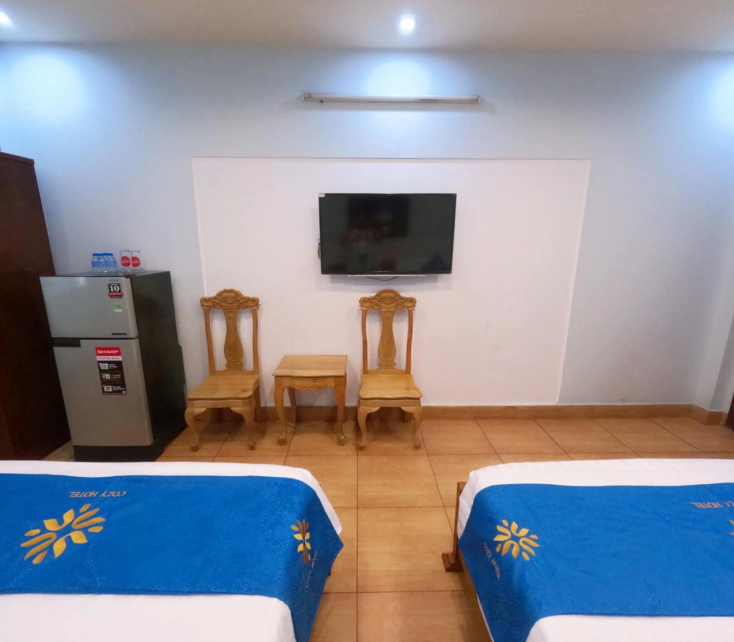 Bed in COZY Hotel HCM