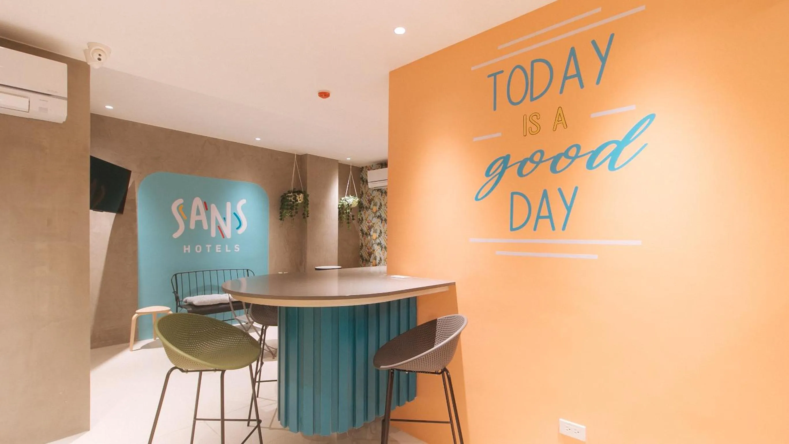 Seating area in Sans Hotel at One JD Place Makati by RedDoorz