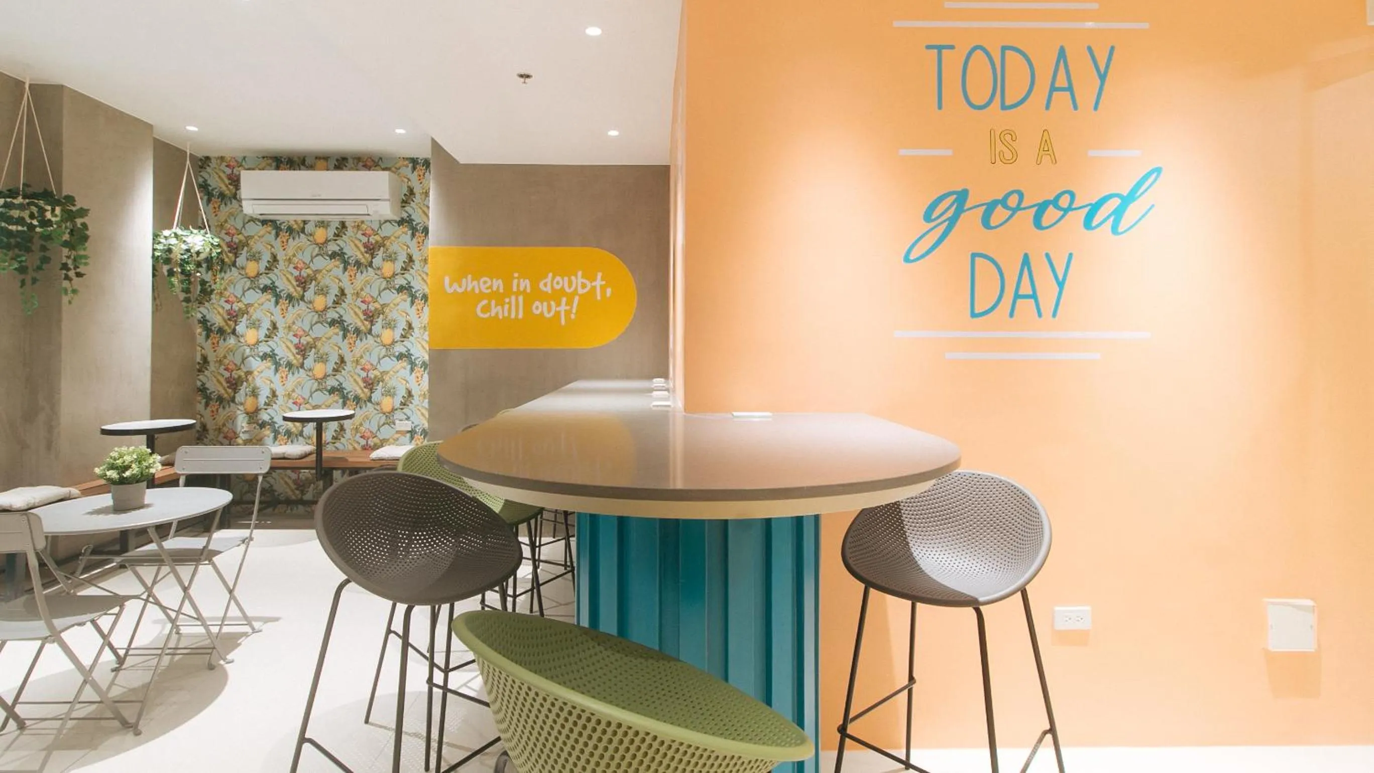 Seating area in Sans Hotel at One JD Place Makati by RedDoorz