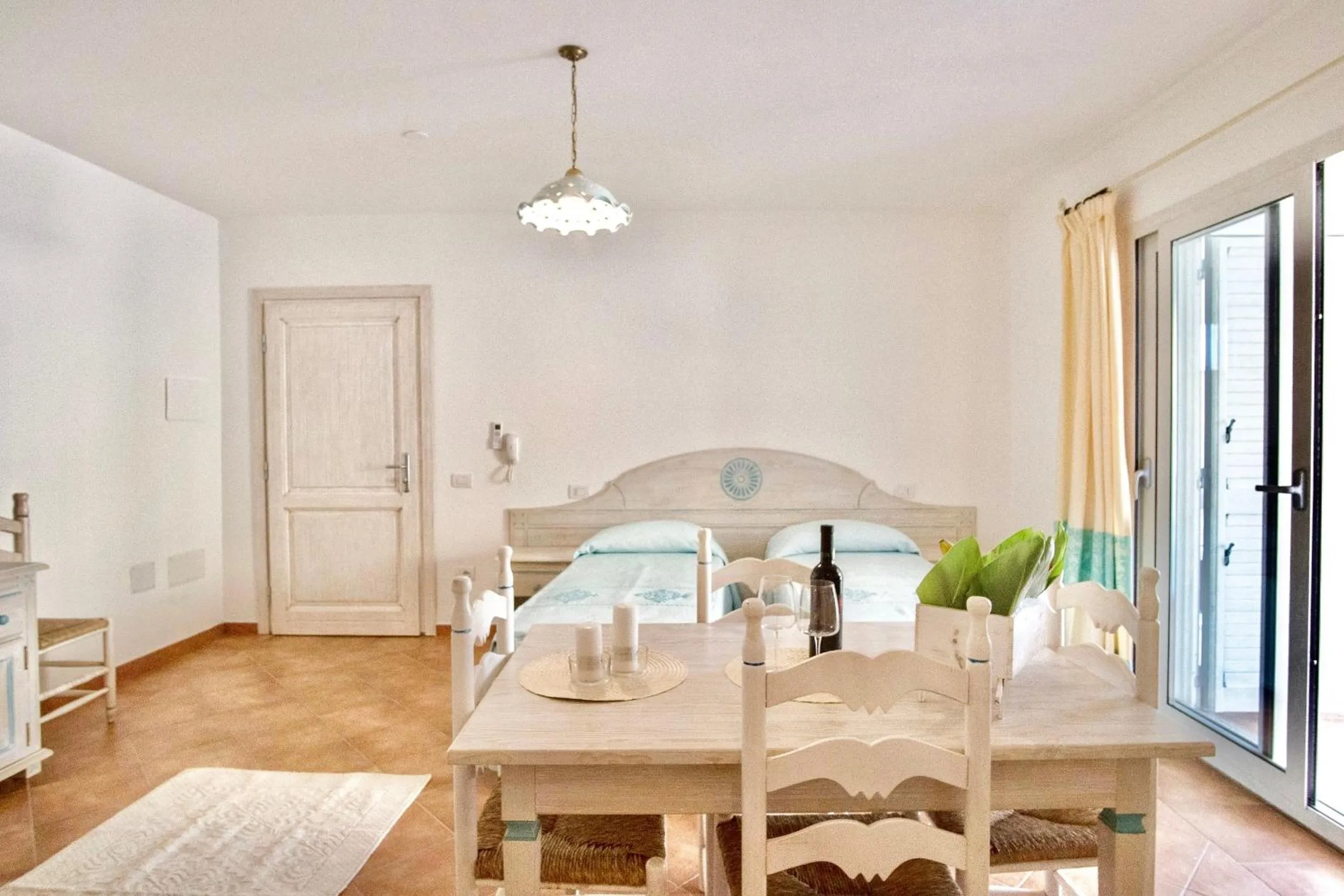 Living room, Bed in Apartments with air conditioning in Orosei