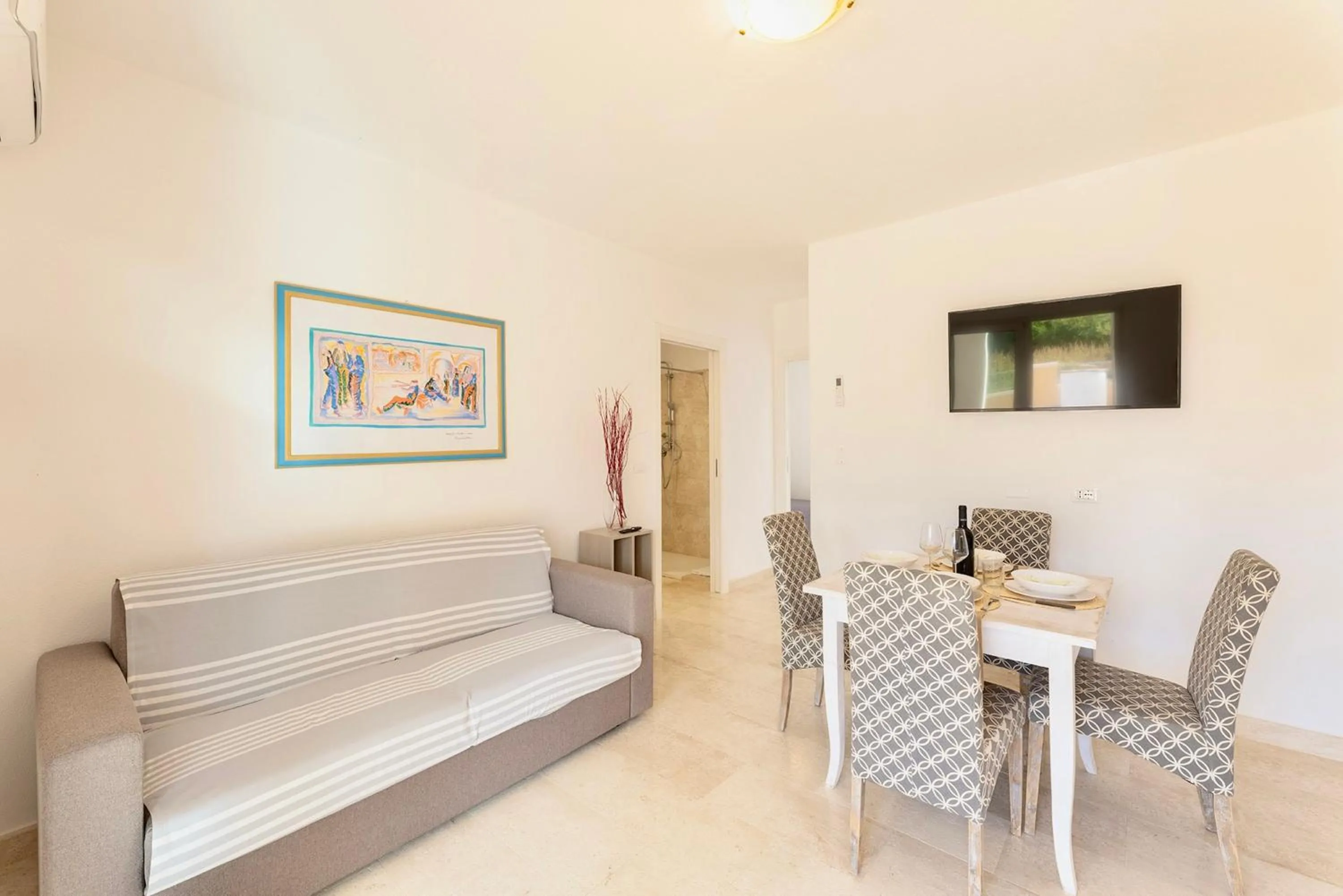 Living room, Bed in Apartments with air conditioning in Orosei