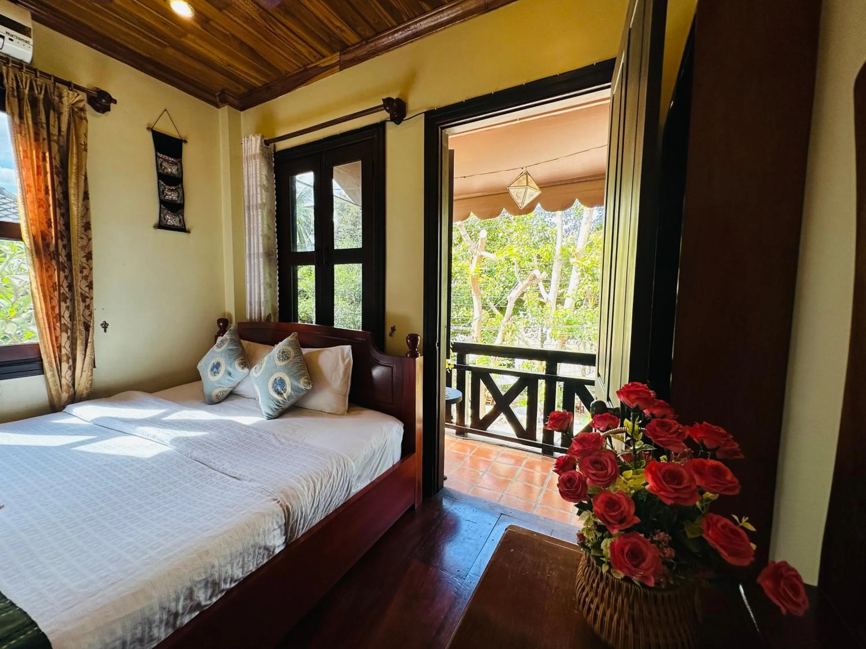 Bed in Anisa Mekong Riverside Villa