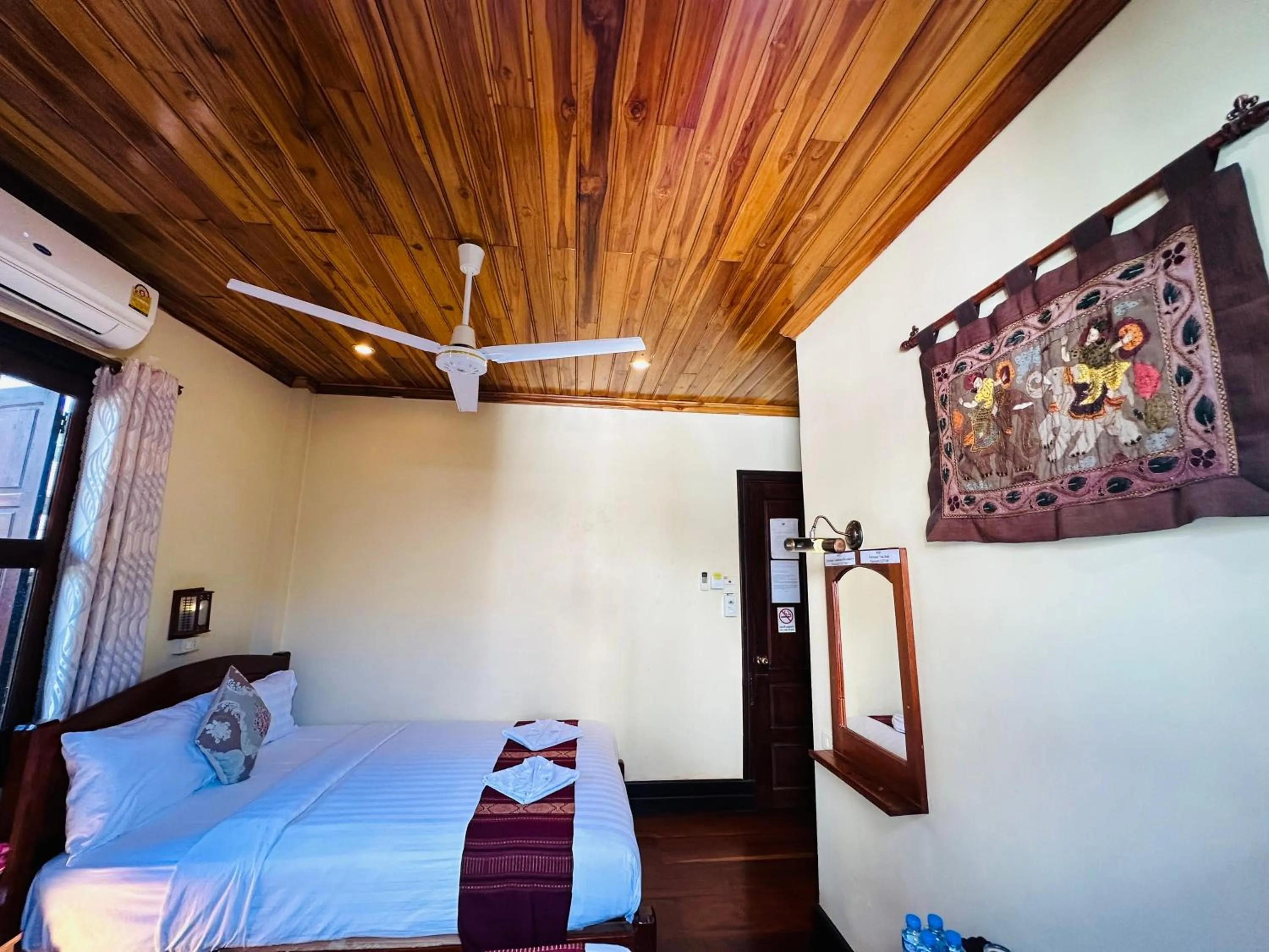 Bed in Anisa Mekong Riverside Villa