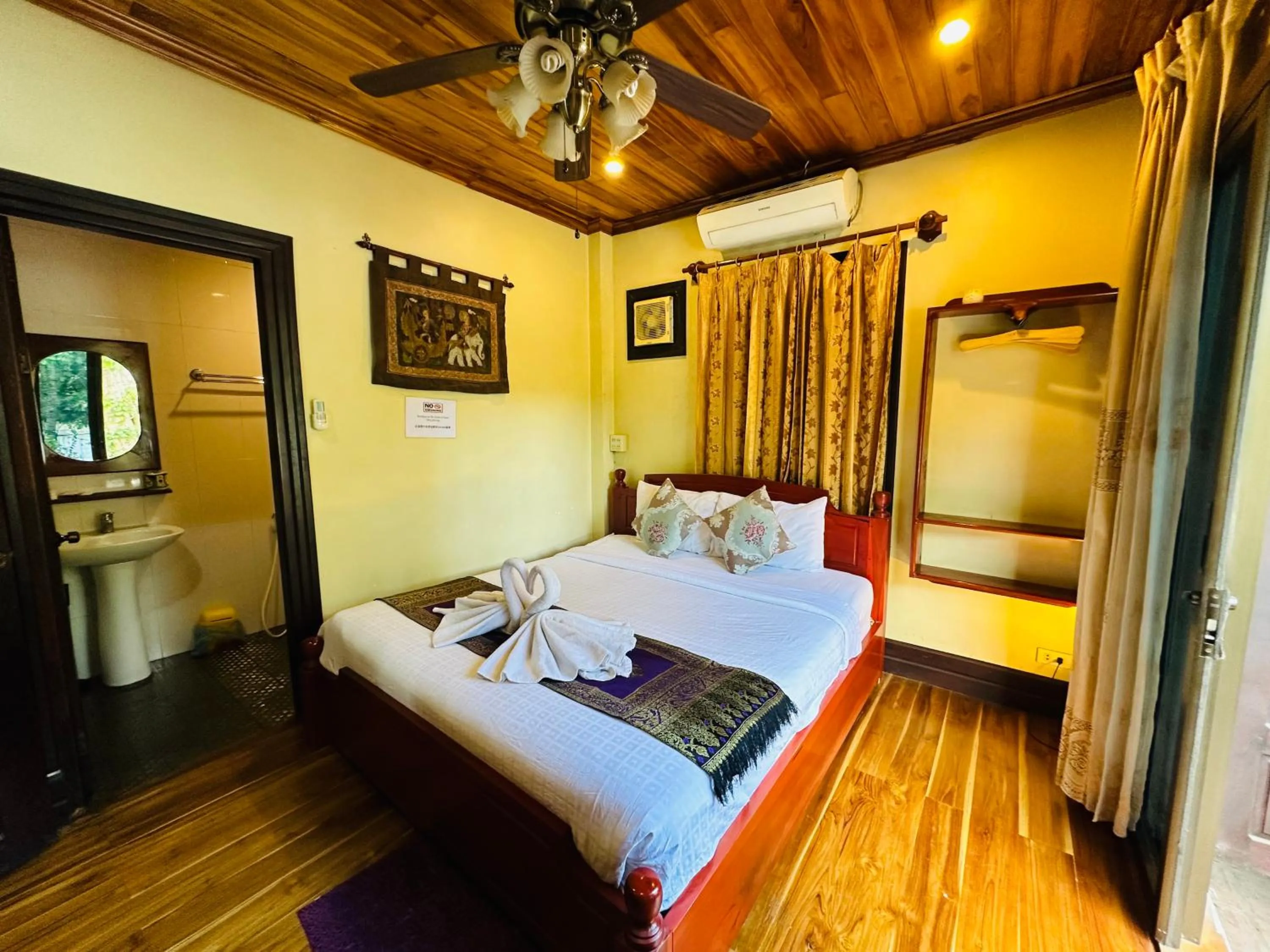 Bed in Anisa Mekong Riverside Villa