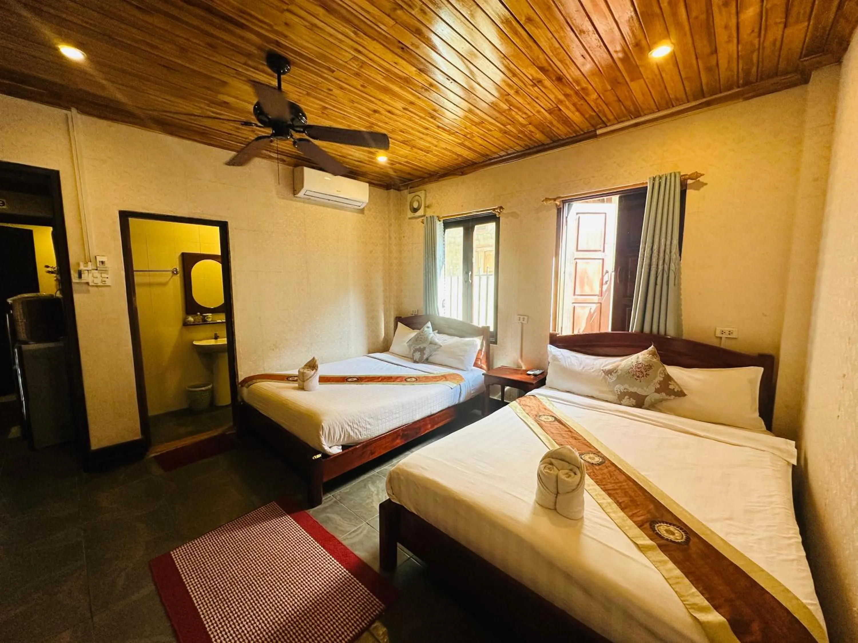 Bed in Anisa Mekong Riverside Villa