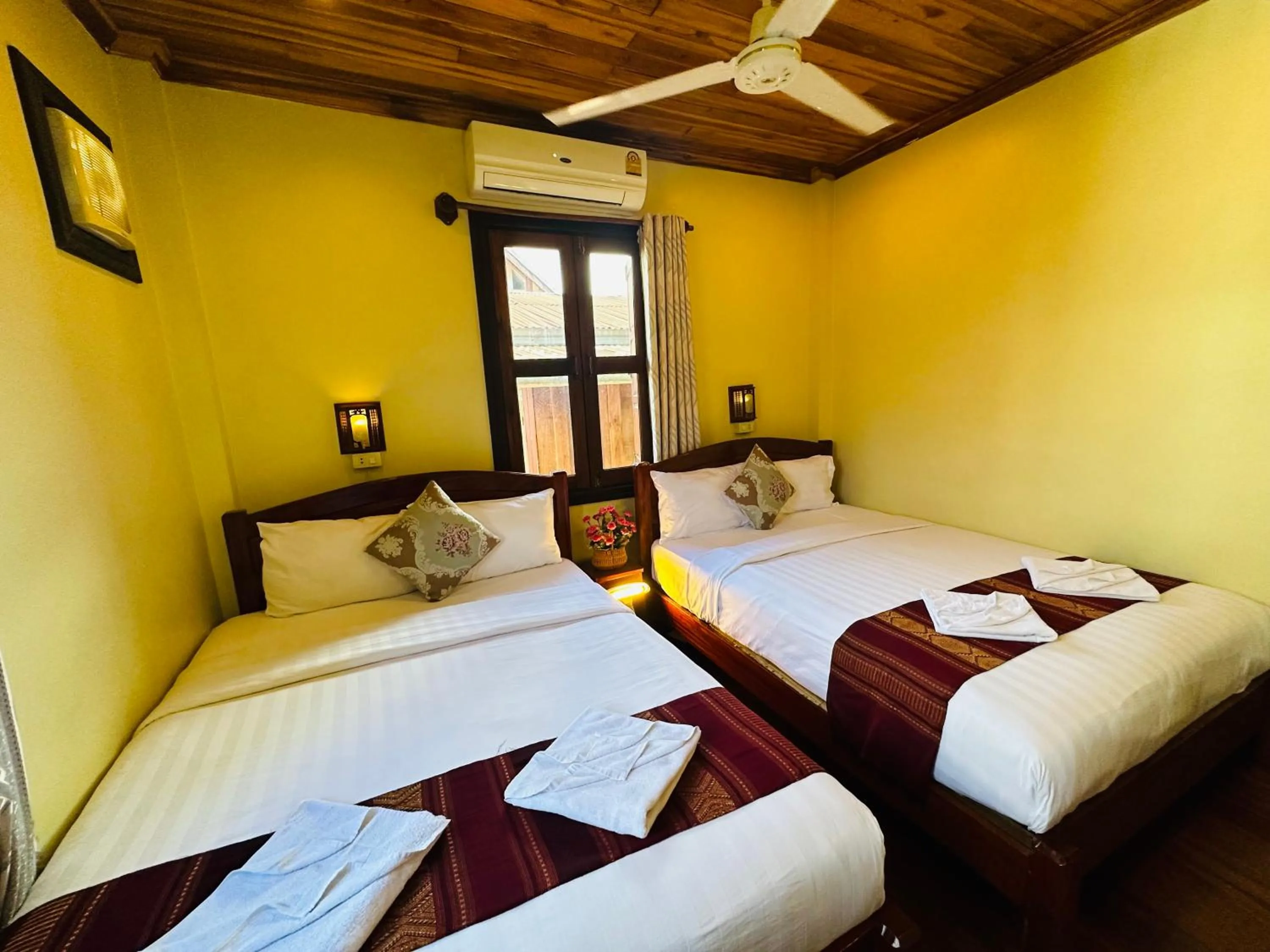 Bed in Anisa Mekong Riverside Villa