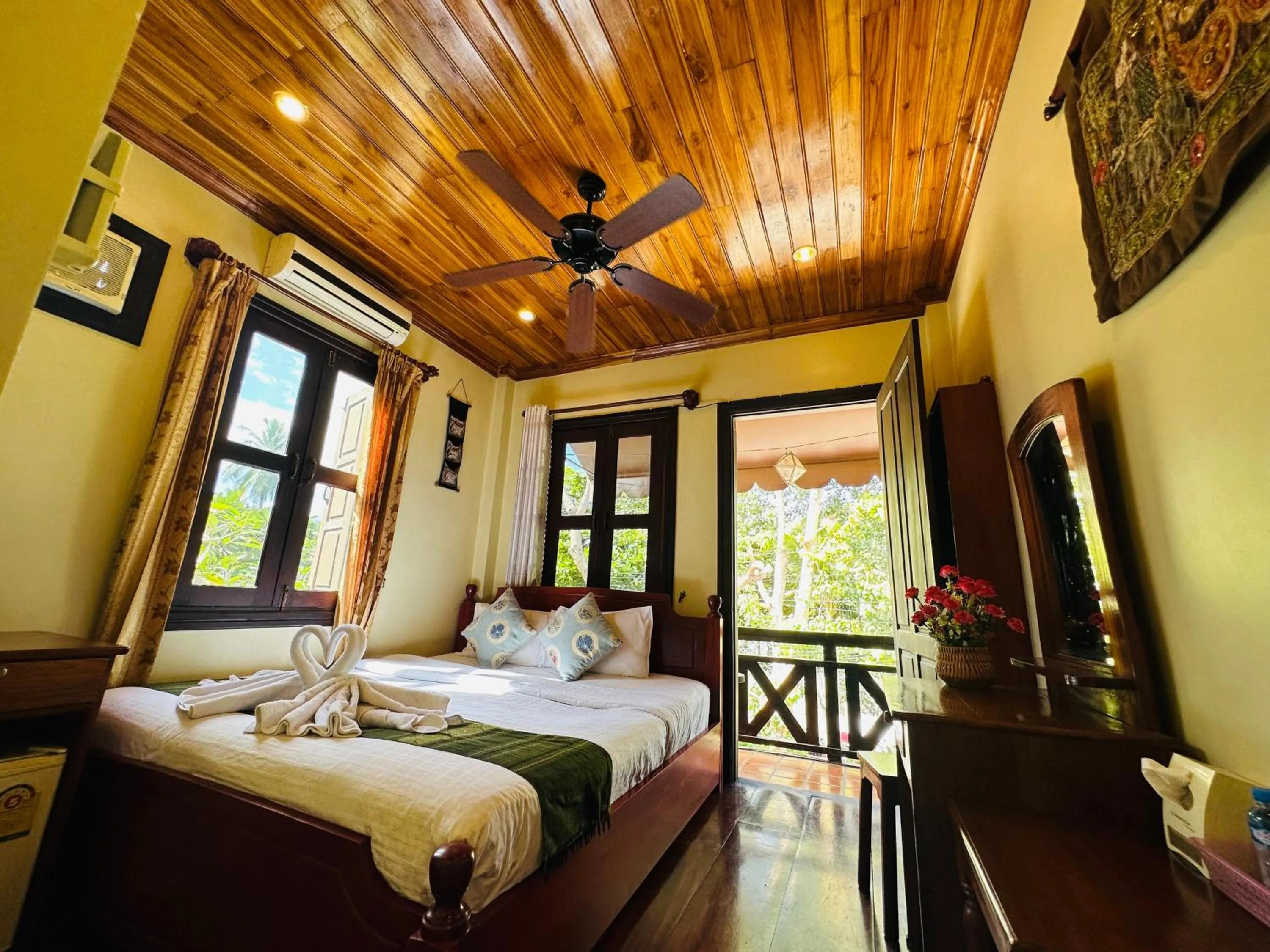 Bed in Anisa Mekong Riverside Villa