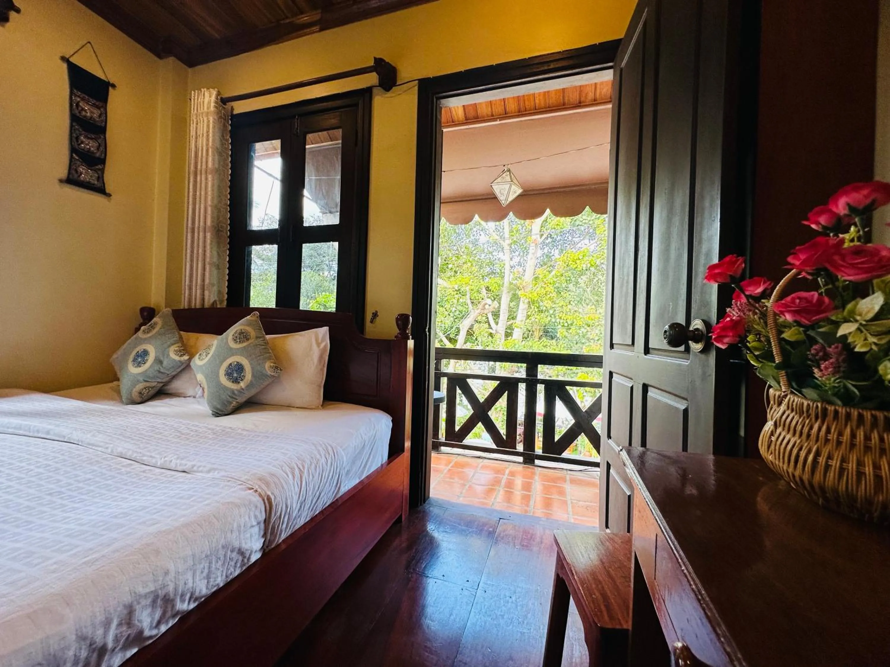 Bed in Anisa Mekong Riverside Villa