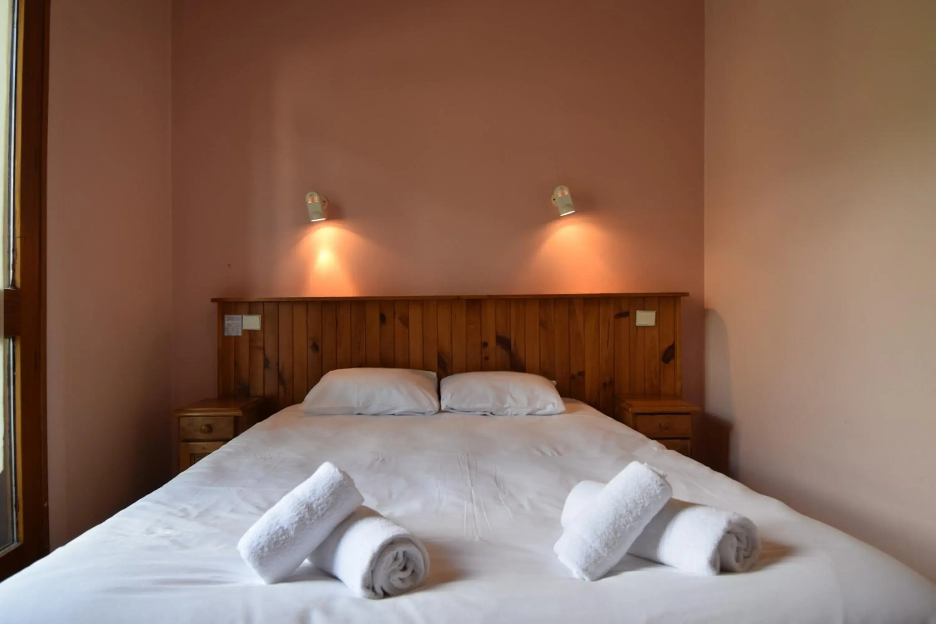 Bed in Hôtel Le MontBlanc Bed in Hôtel Le MontBlanc