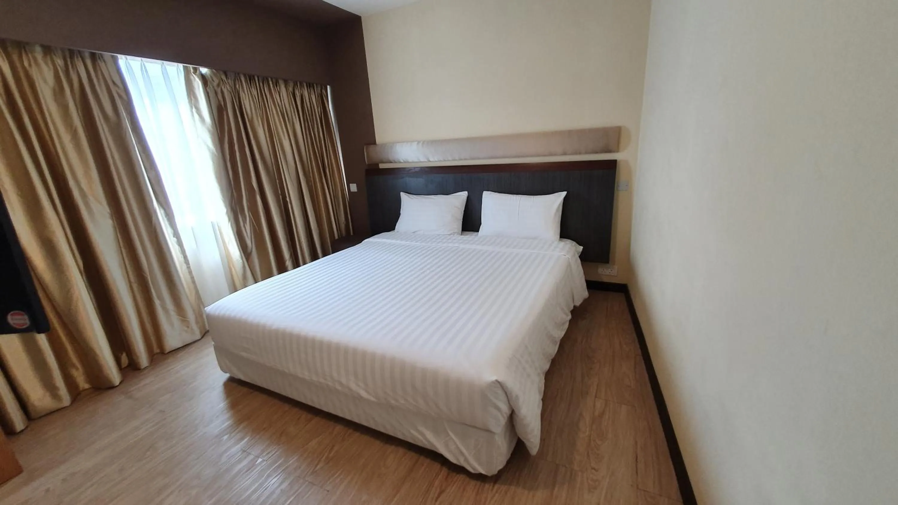 Bed in The Capital Residence Suites