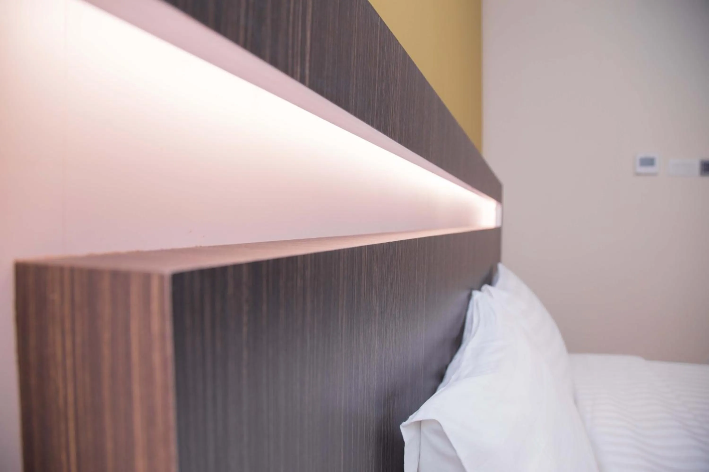 Bed in The Capital Residence Suites