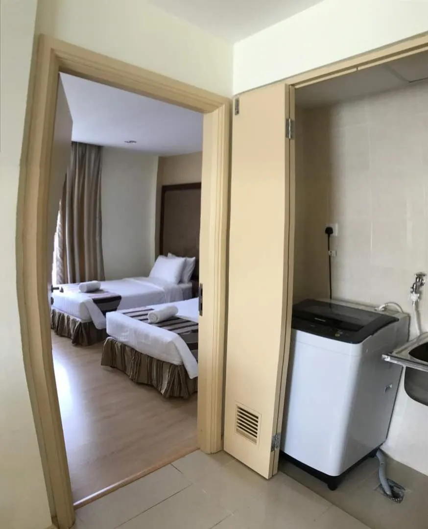 Bed in The Capital Residence Suites