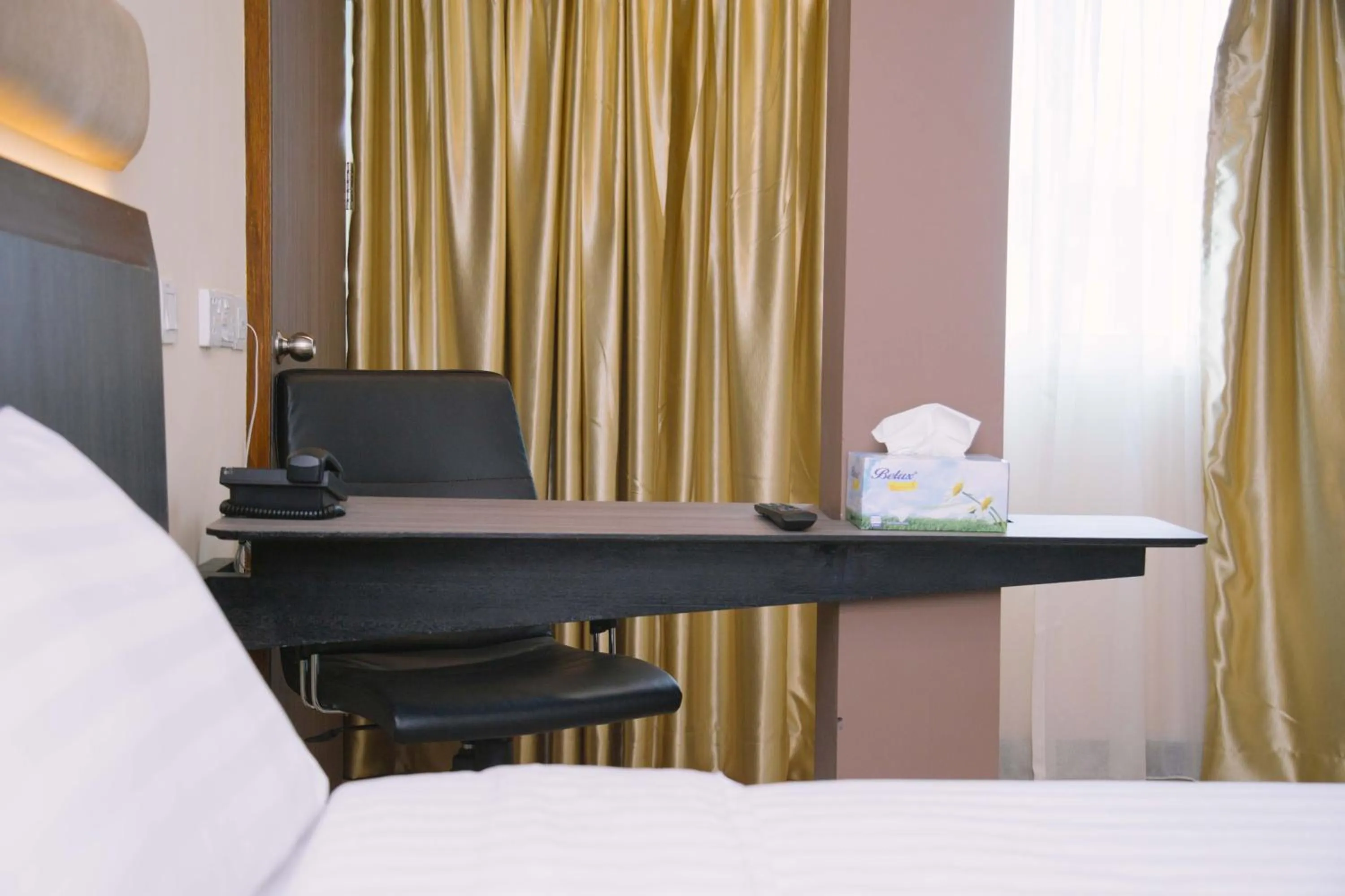 Bed in The Capital Residence Suites