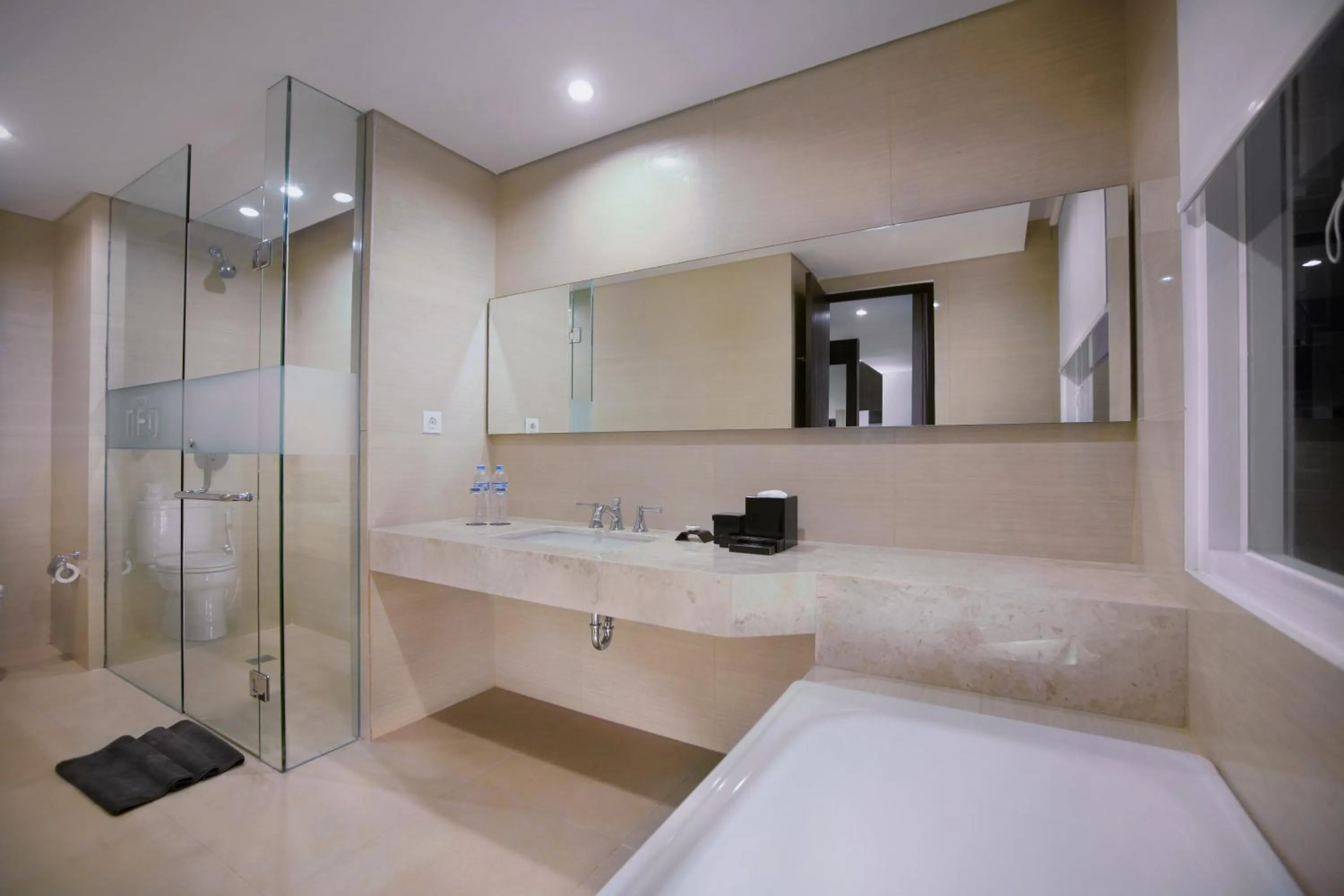 Bathroom, Bed in Neo Denpasar by ASTON
