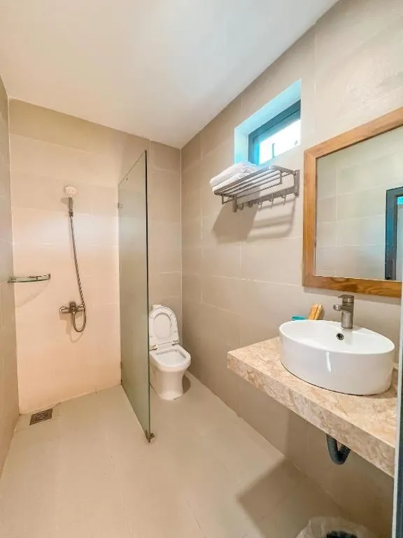 Shower in ARECA MUINE HOMESTAY