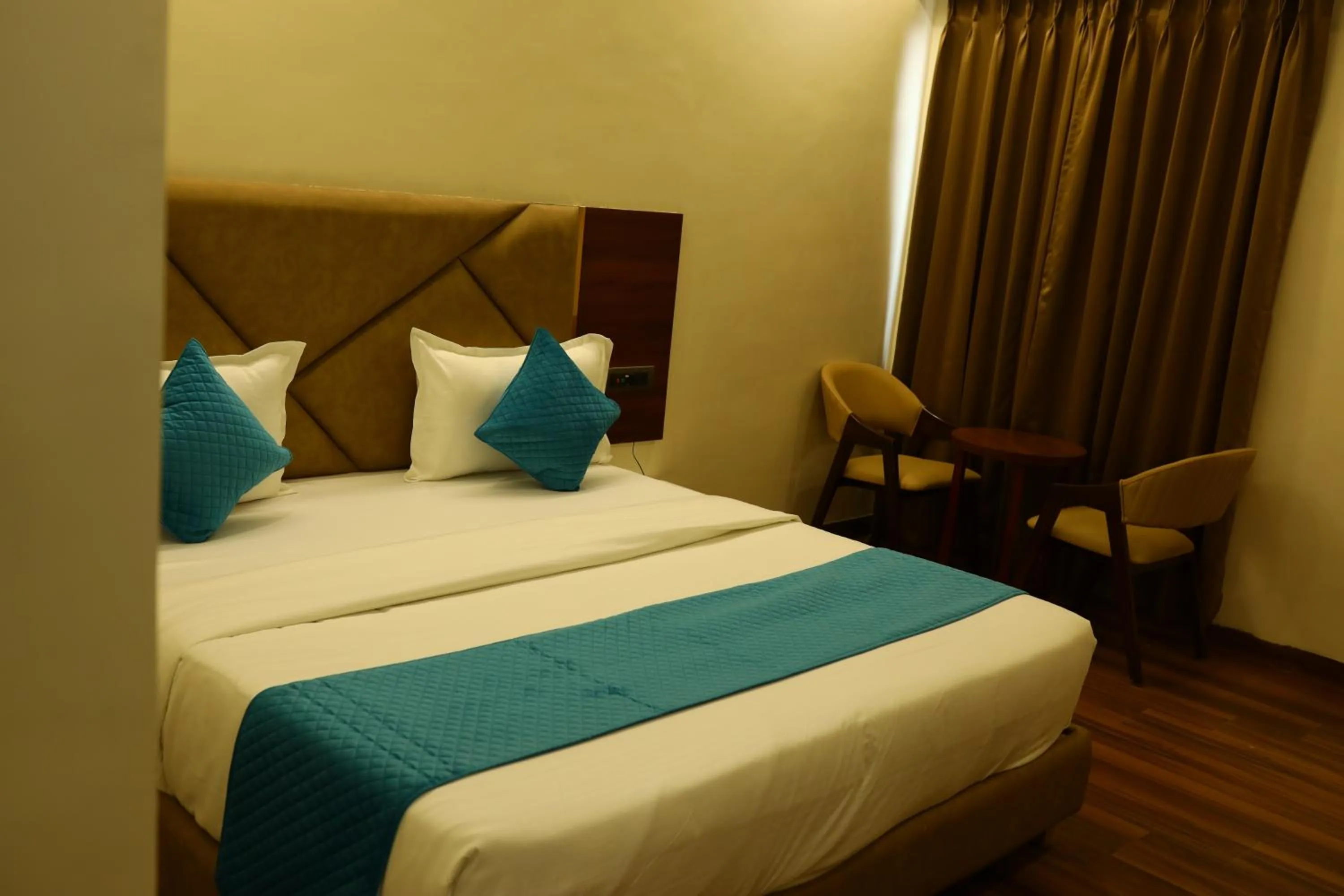 Bedroom in The Imperial By Vinayak Hotels