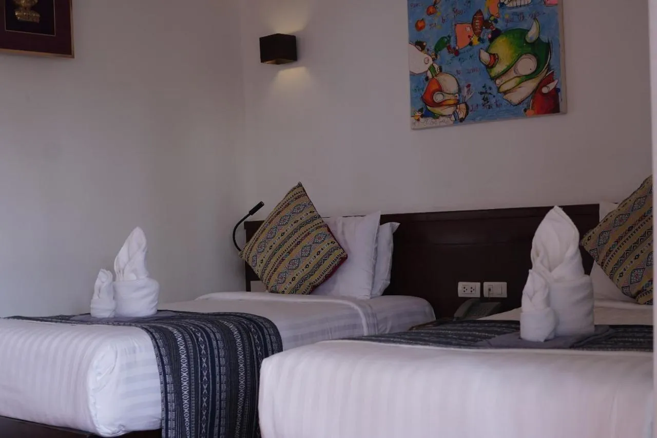 Bed in Baan Huenphen Boutique Hotel