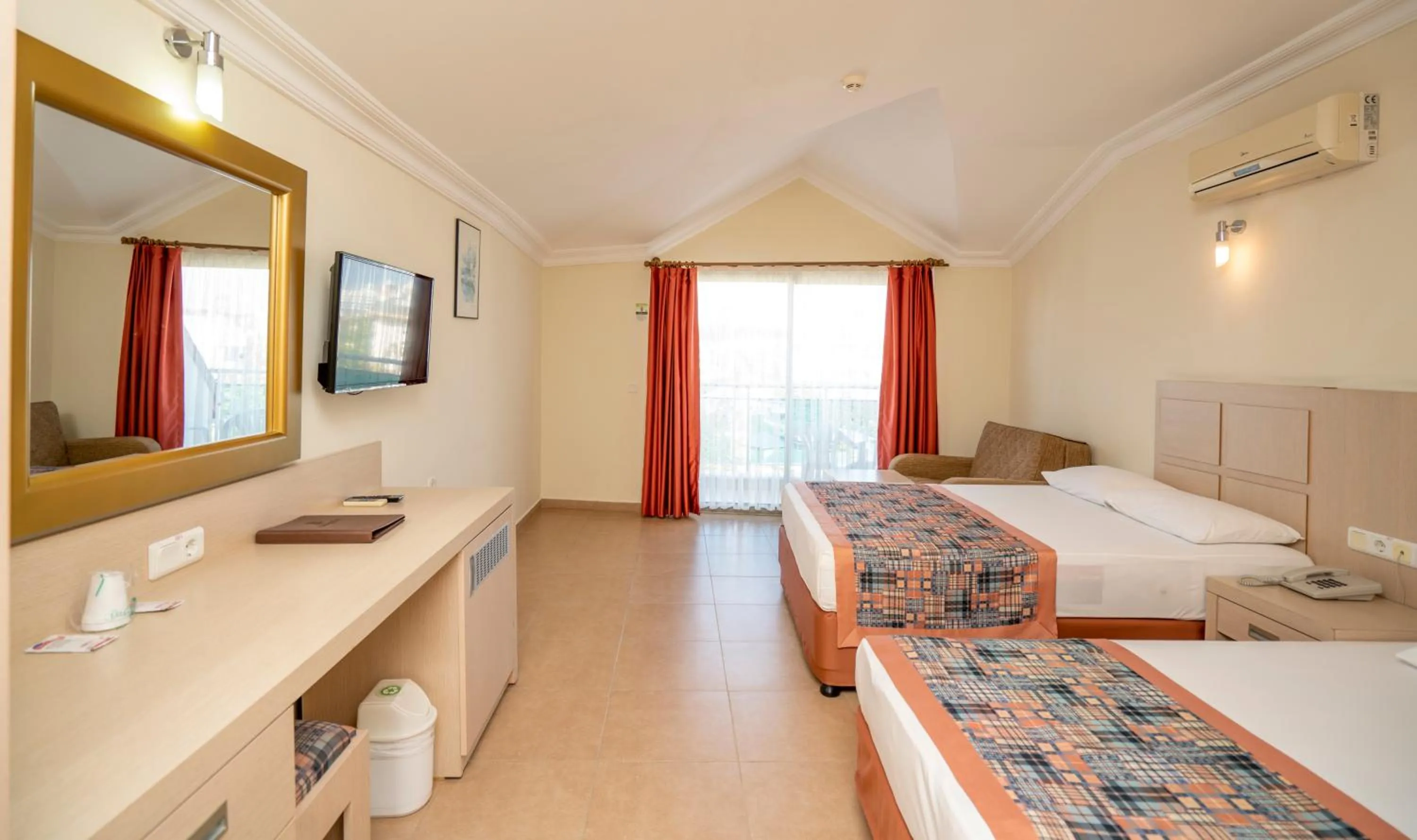 Bed in Gardenia Beach Hotel