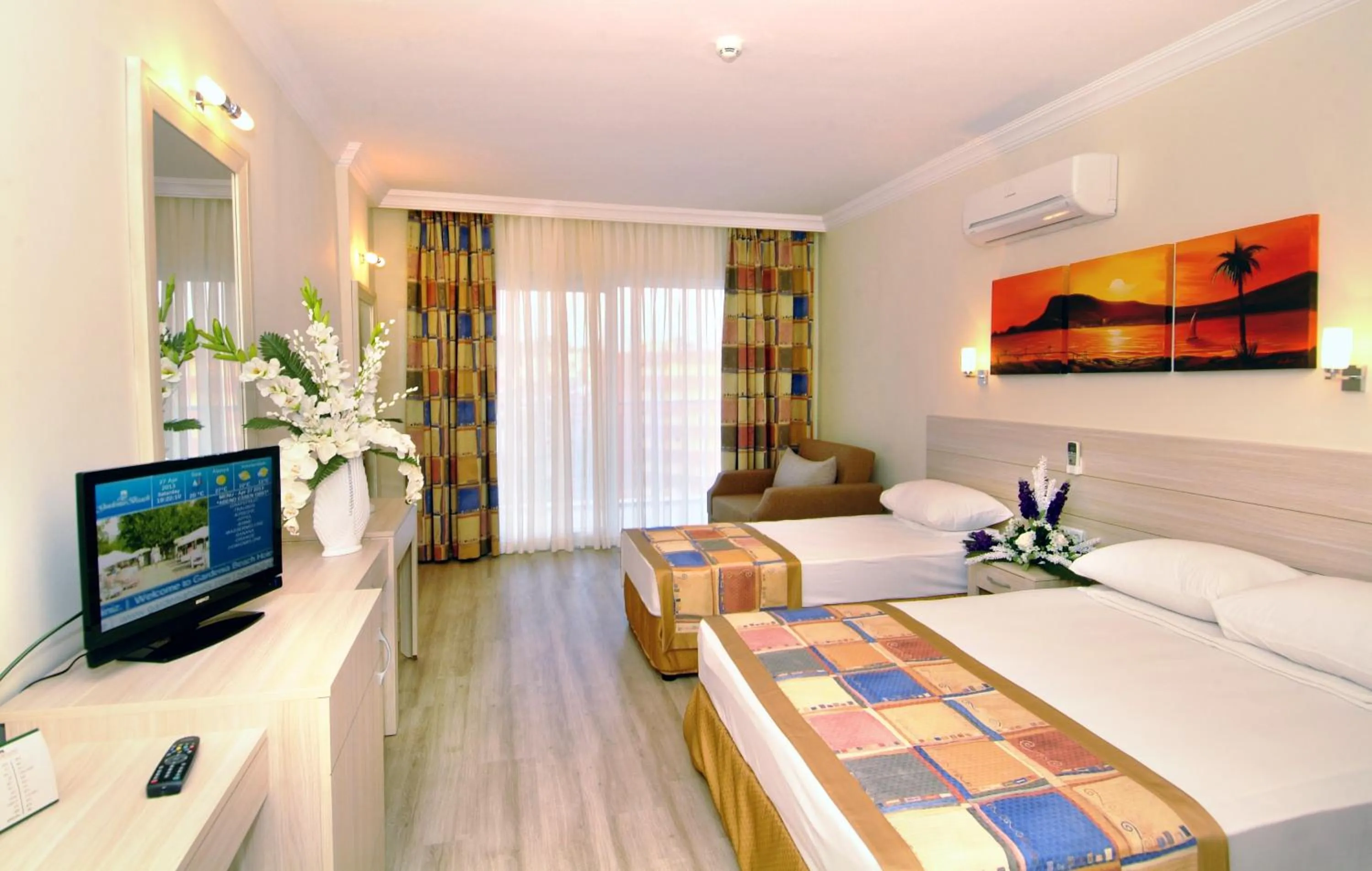 Bed in Gardenia Beach Hotel