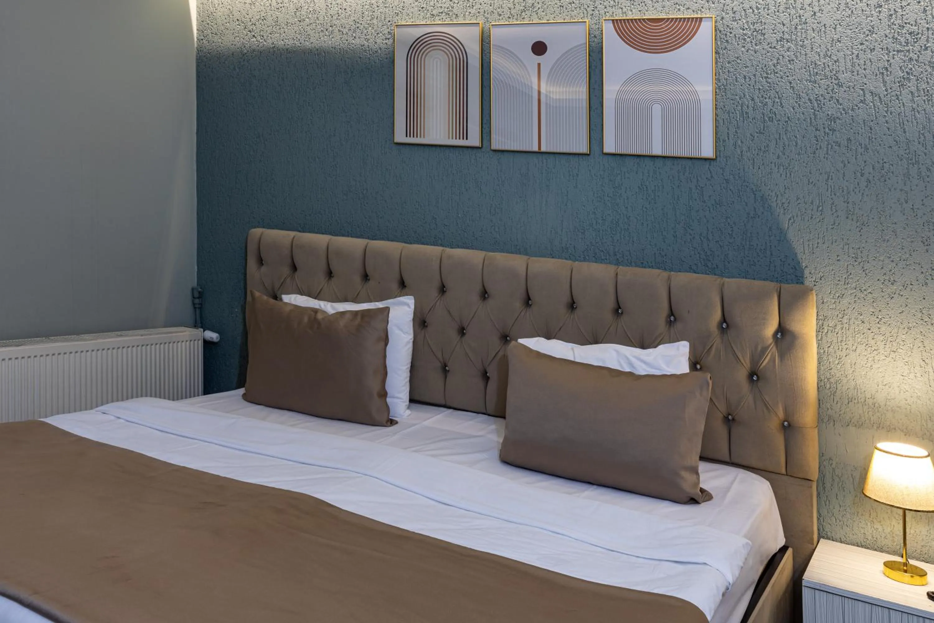 Bed in LINNGA HOTEL & SUITE