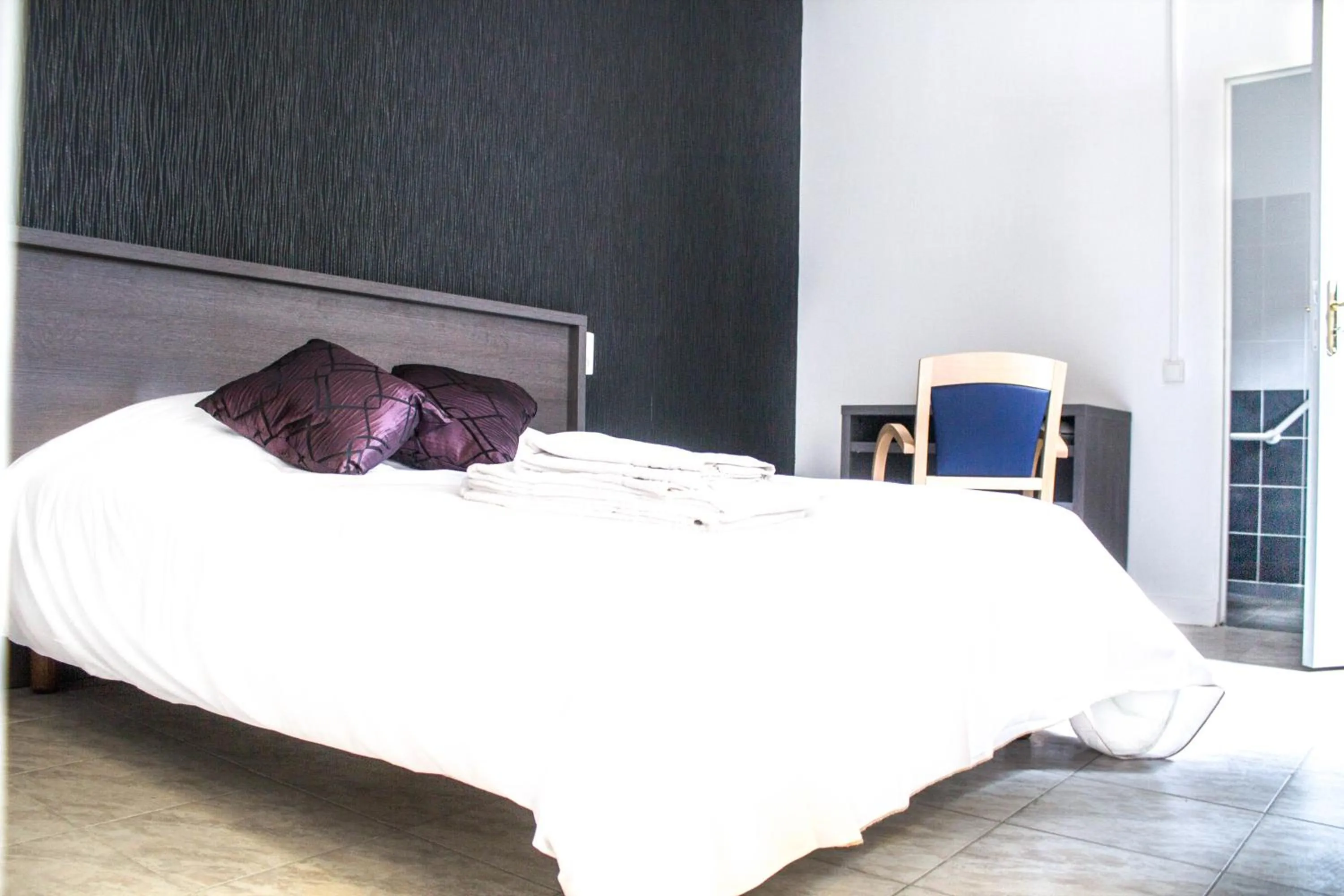 Bed in Hotel Le Jardin