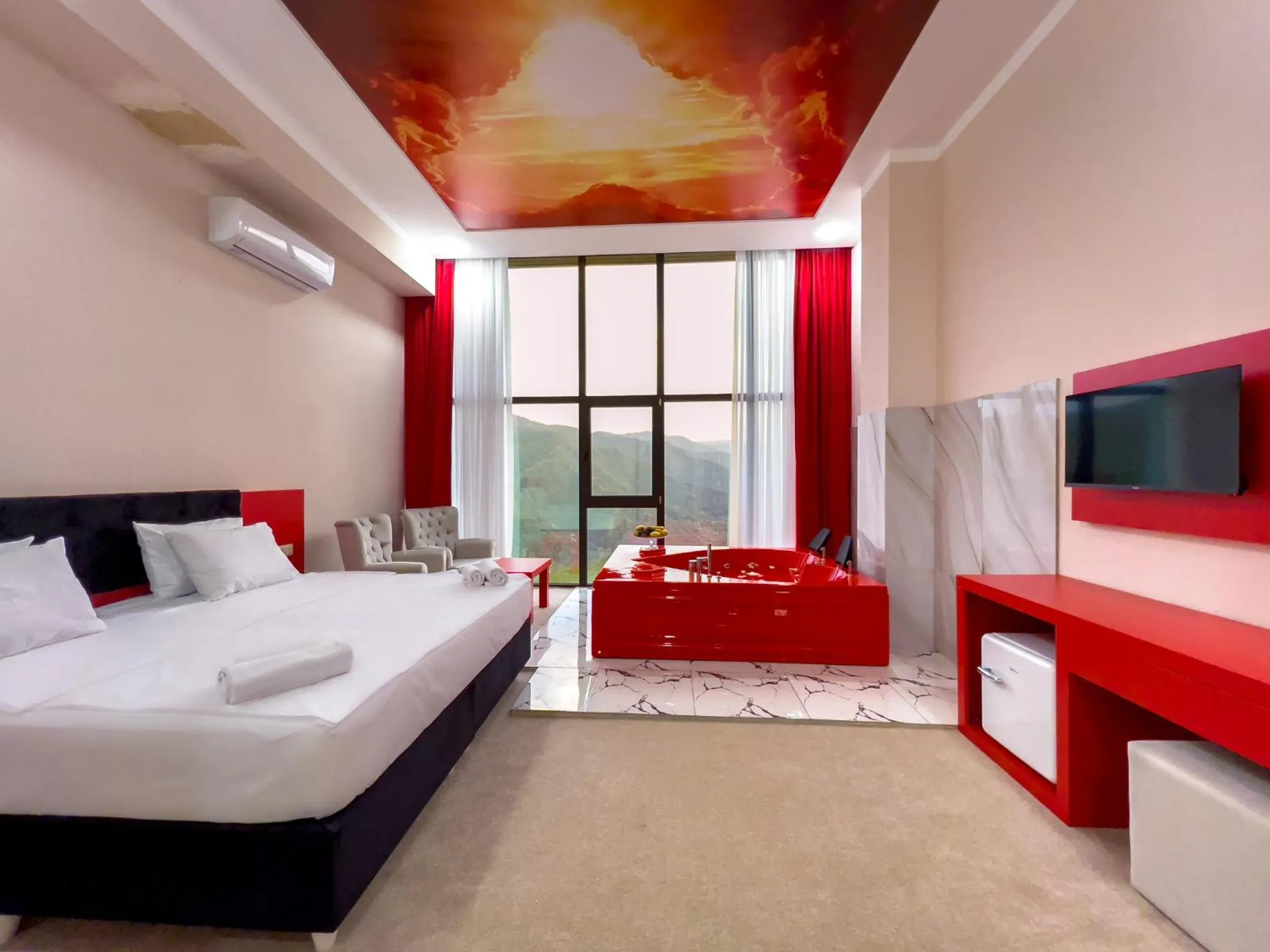 Communal lounge/ TV room, Bed in Chateau Milisi