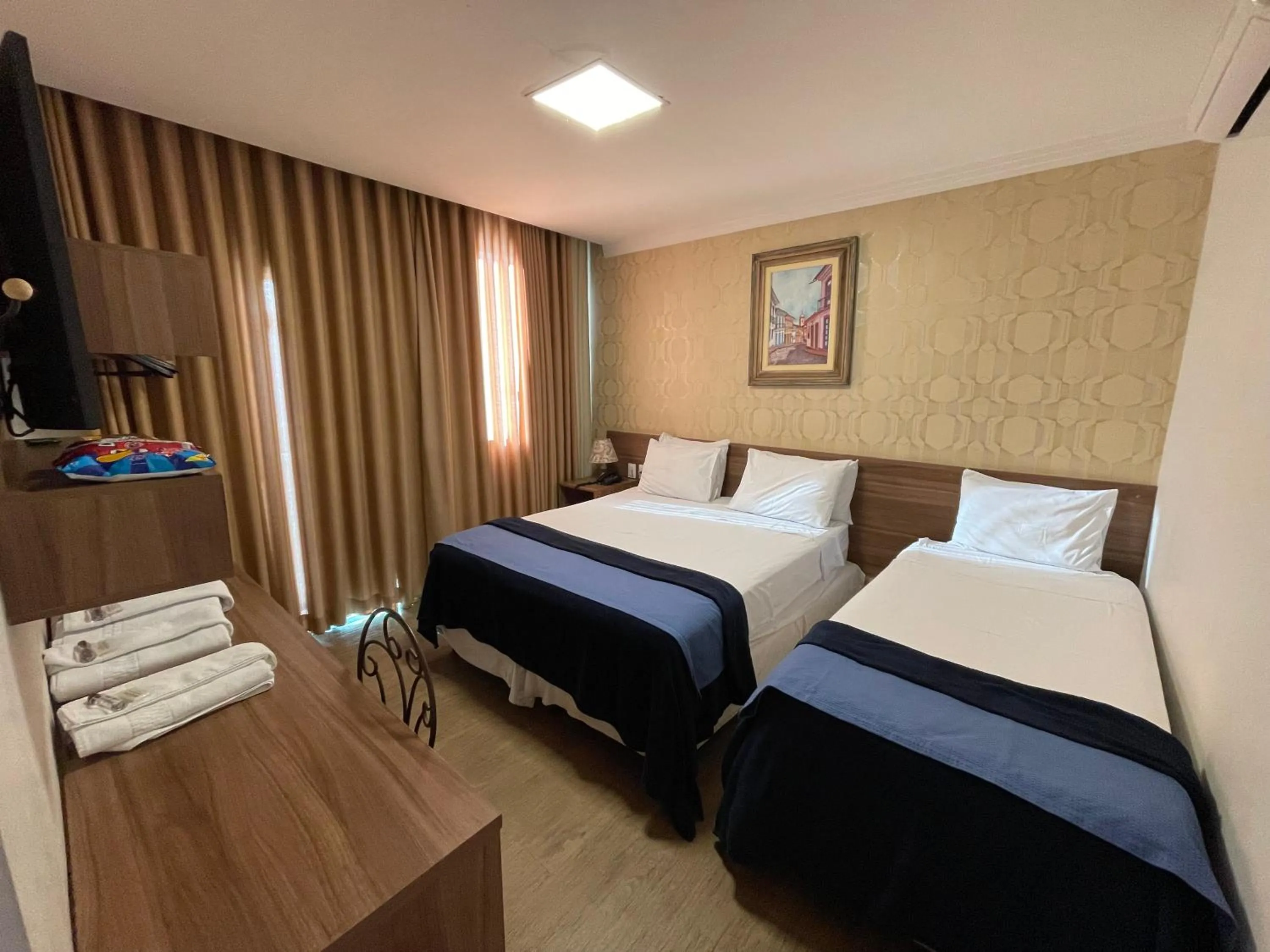 Bed in Pousada Circuito dos Inconfidentes