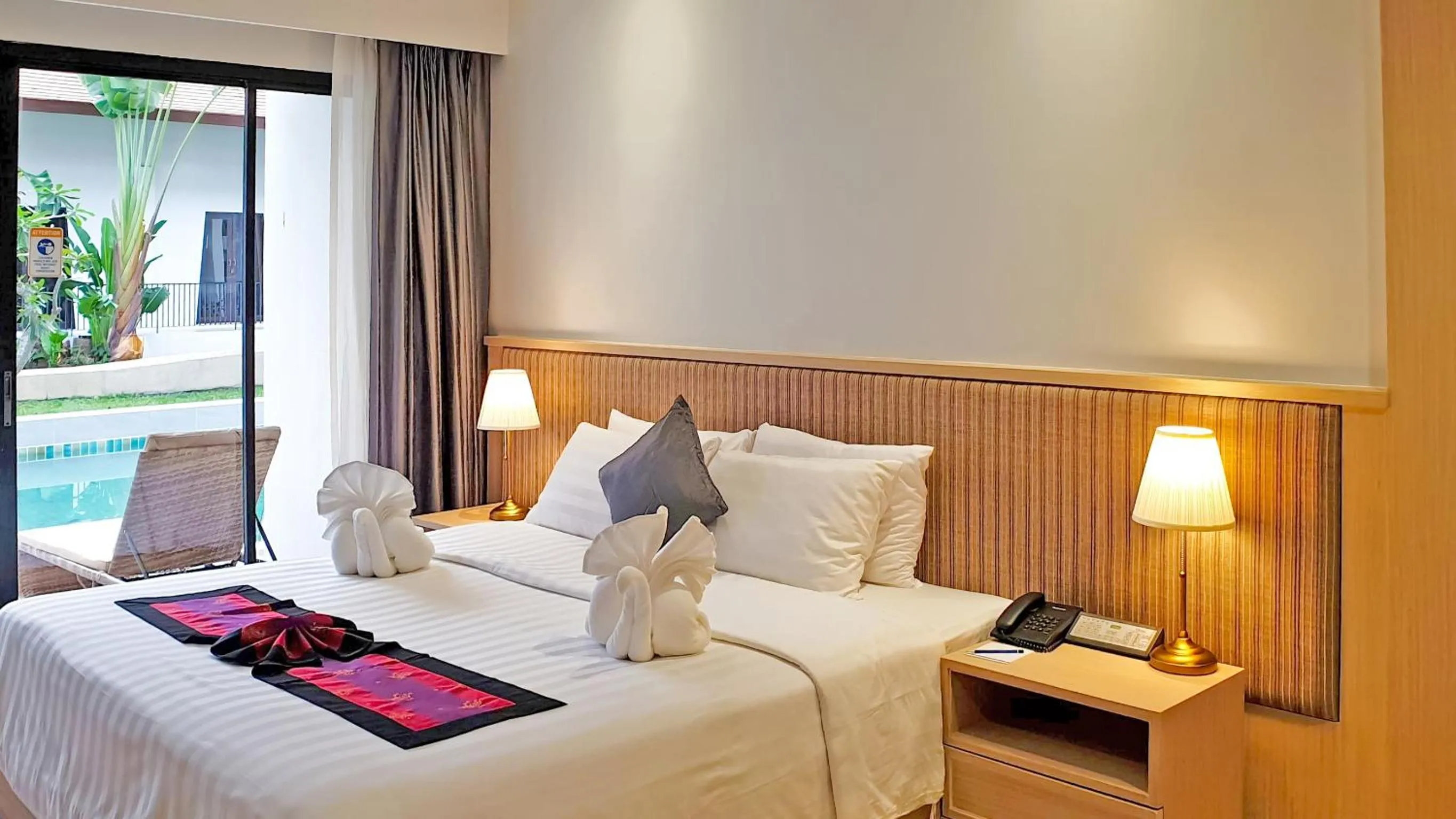 Bed in D Varee Mai Khao Beach Resort, Thailand