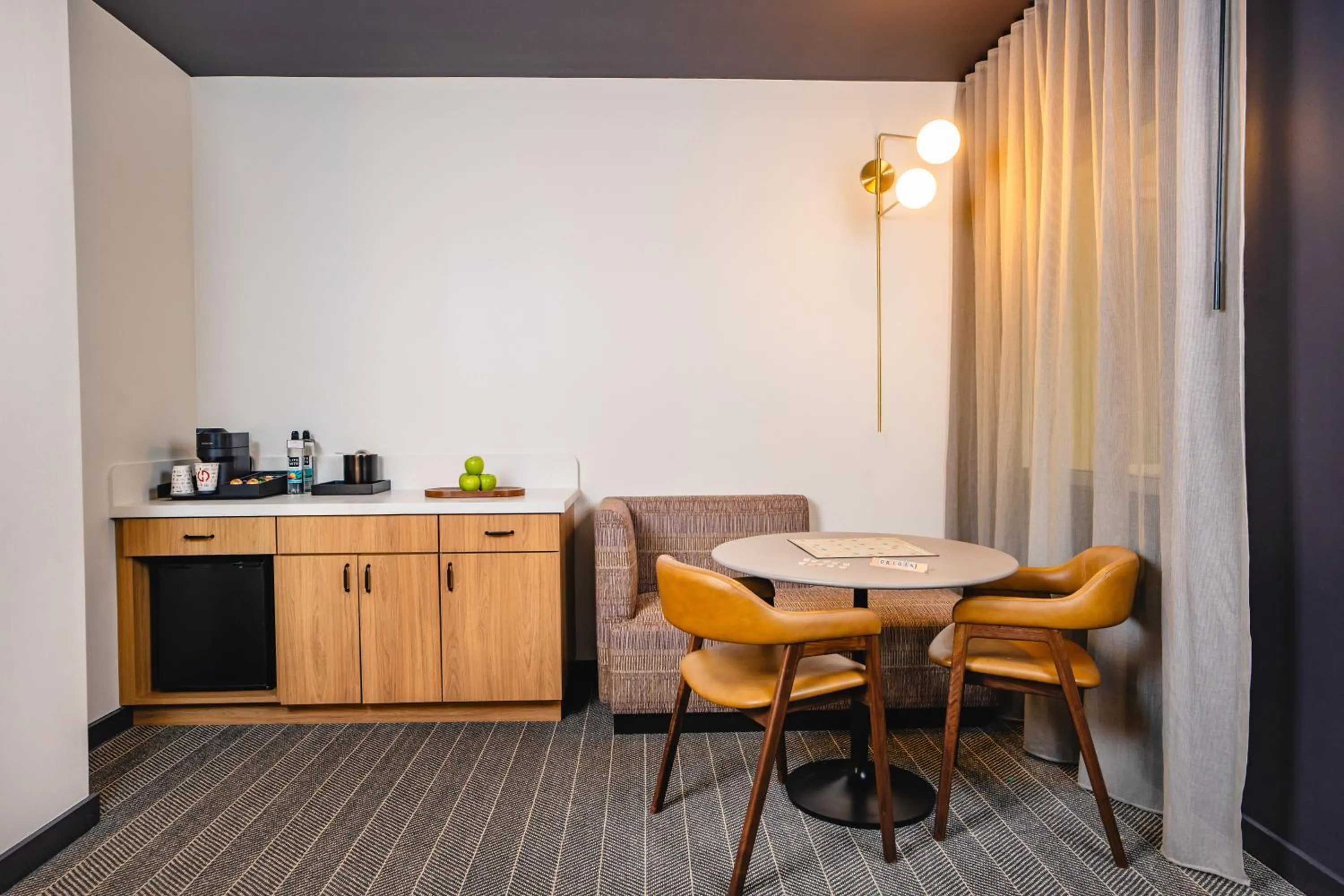 Seating area in Origin Baton Rouge, a Wyndham Hotel