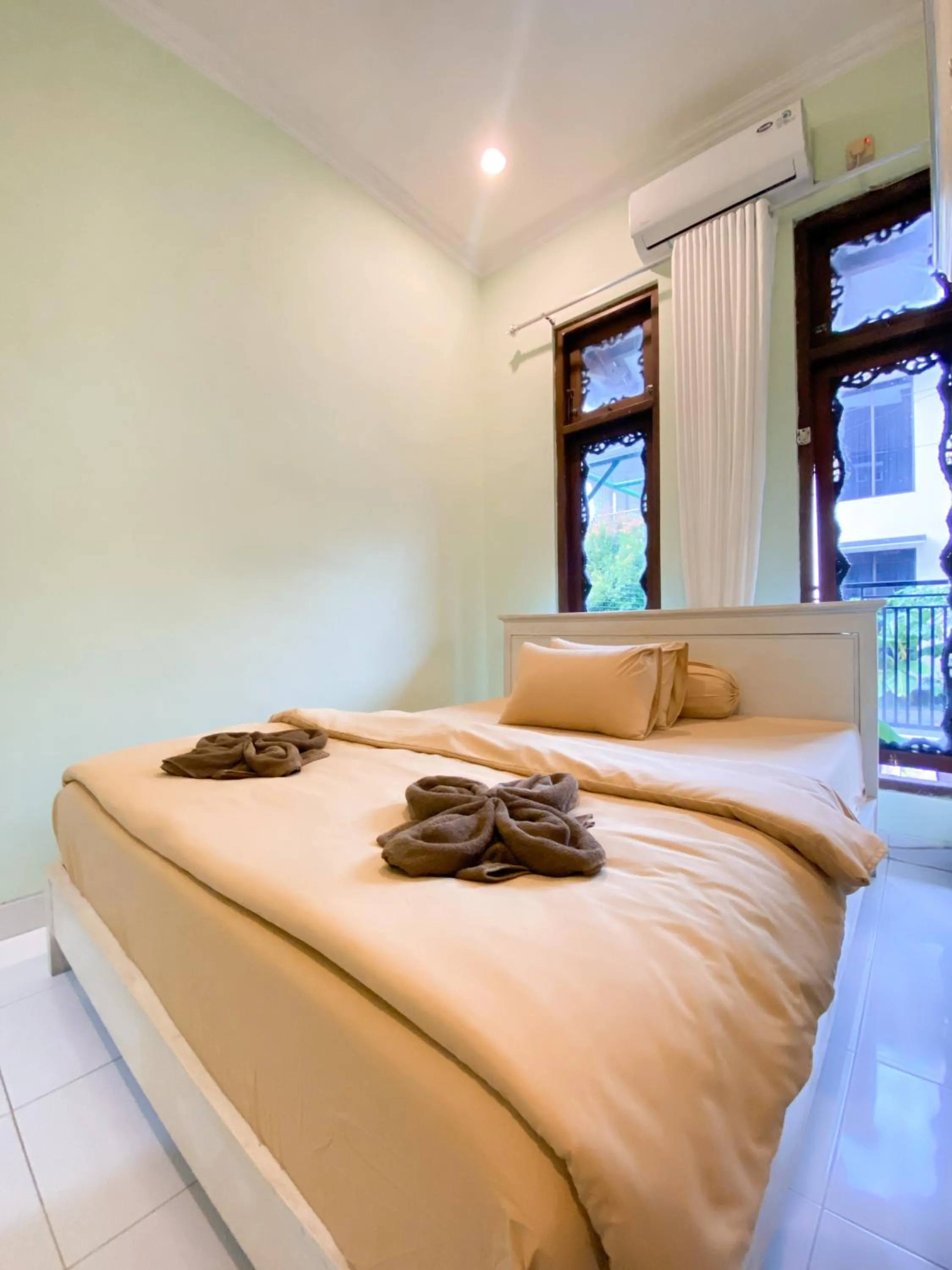 Bed in Homestay Kamar Tamu Gedongkiwo