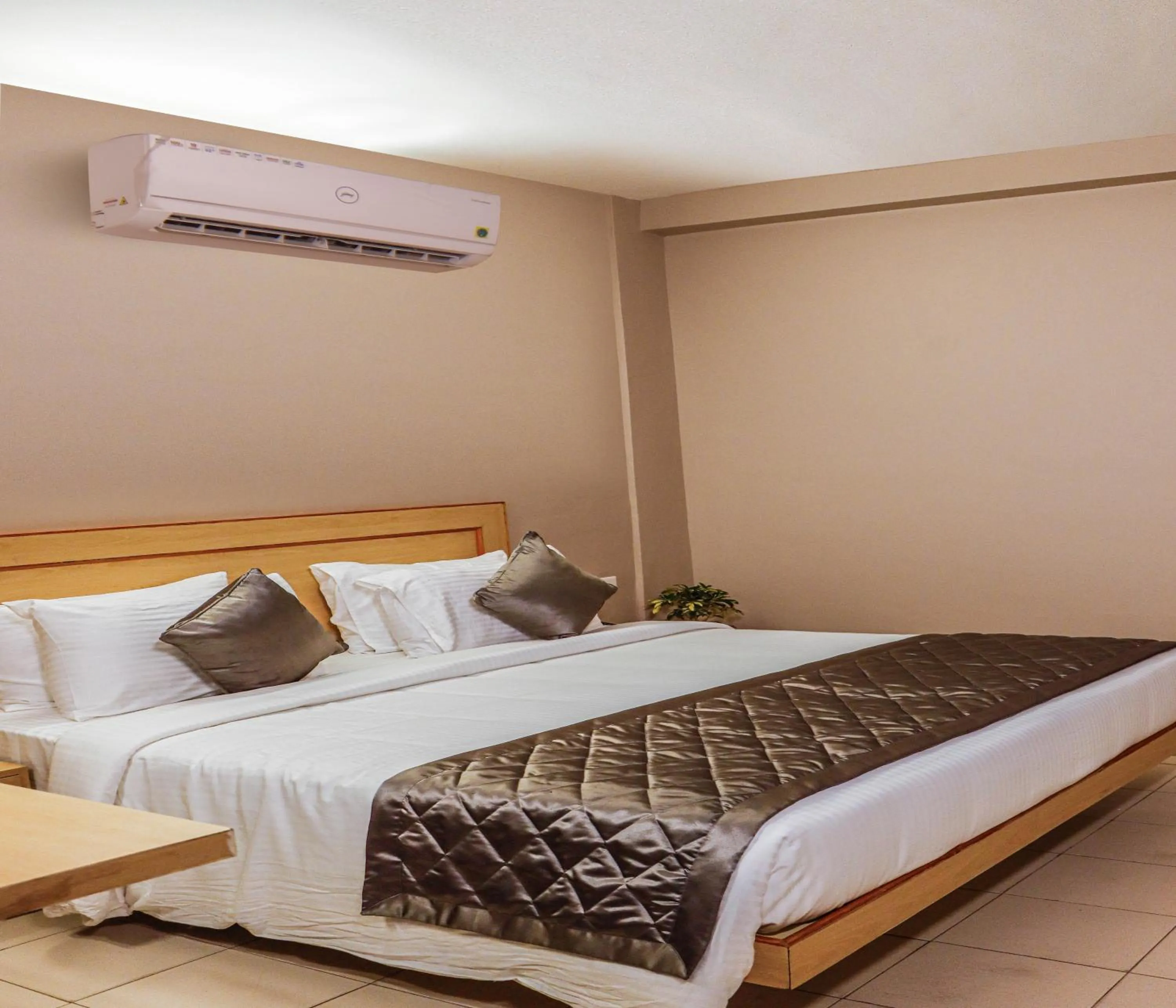 Photo of the whole room, Bed in Hotel Vinayaga Tiruppur