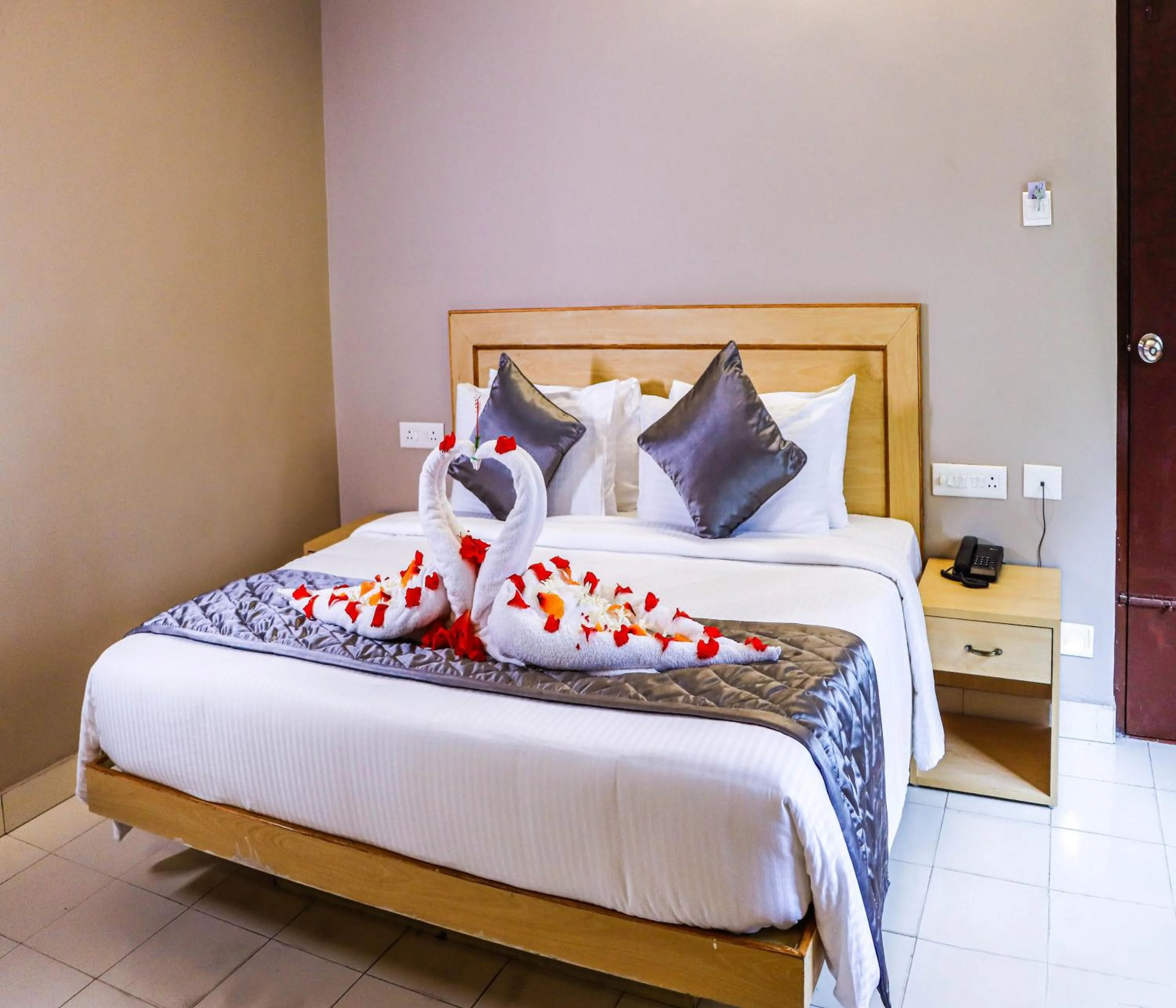 Photo of the whole room, Bed in Hotel Vinayaga Tiruppur