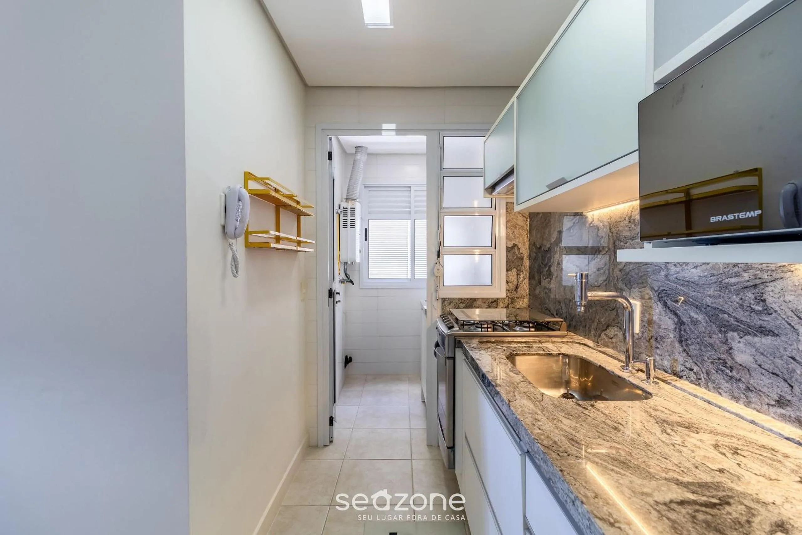 Kitchen or kitchenette in Condomínio Pé na Areia c/ Piscina em Florianópolis - EAR