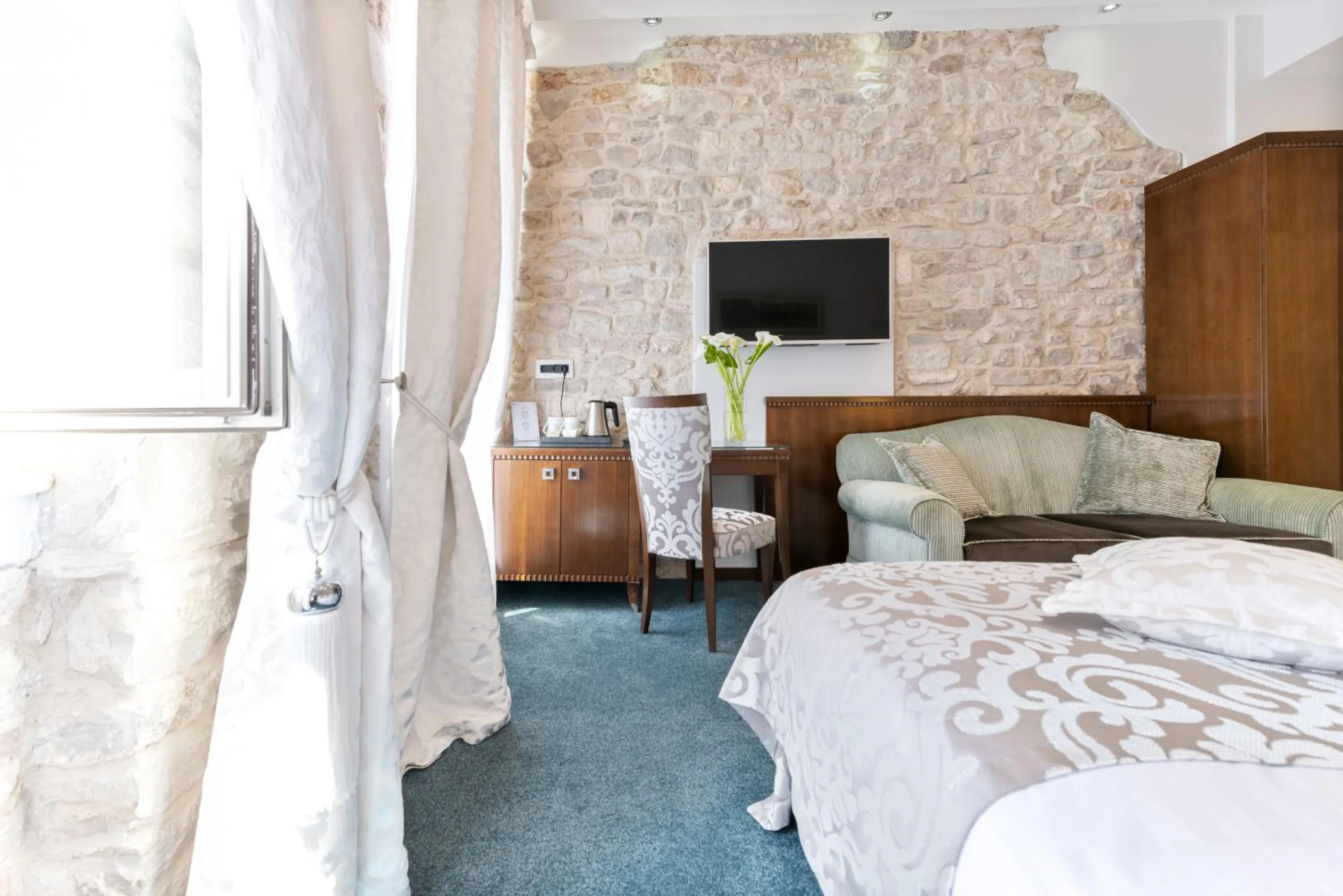 Bed in Heritage Hotel Antique Split