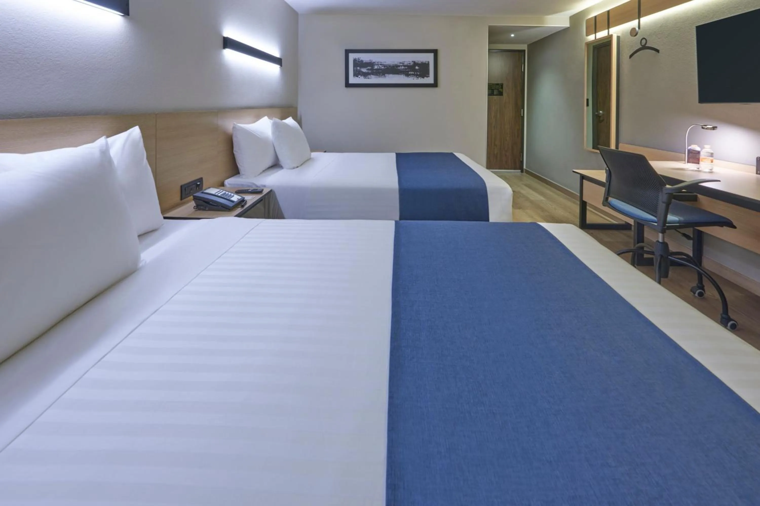 Photo of the whole room, Bed in City Express by Marriott Cancun Aeropuerto