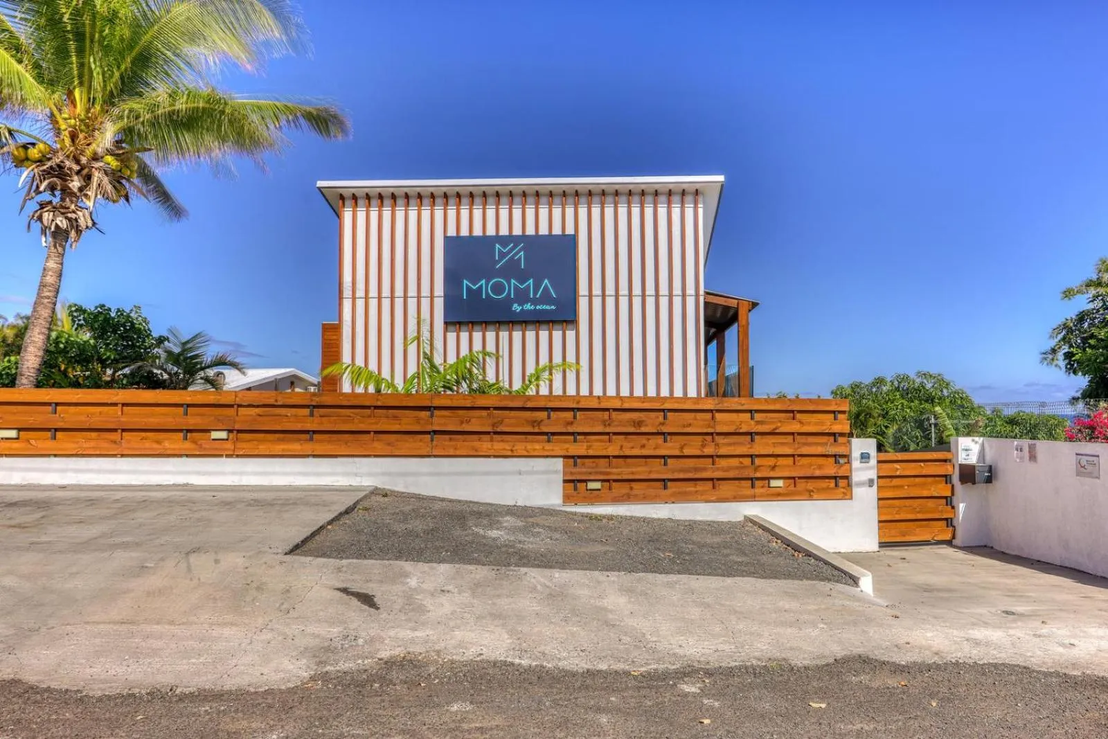 Property logo or sign in Le Moma by the ocean