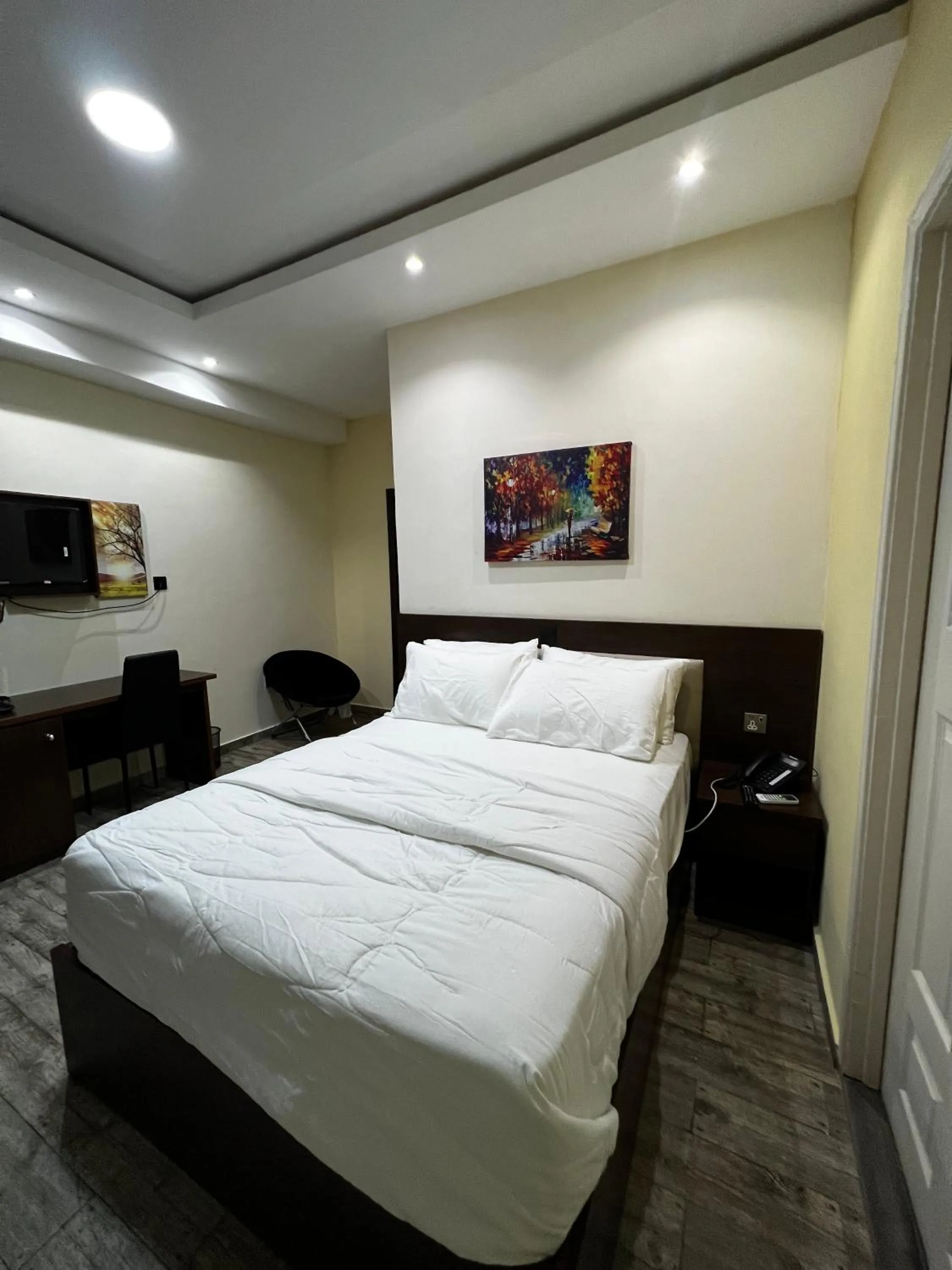 Bed in Fragrance Apartments and Suites