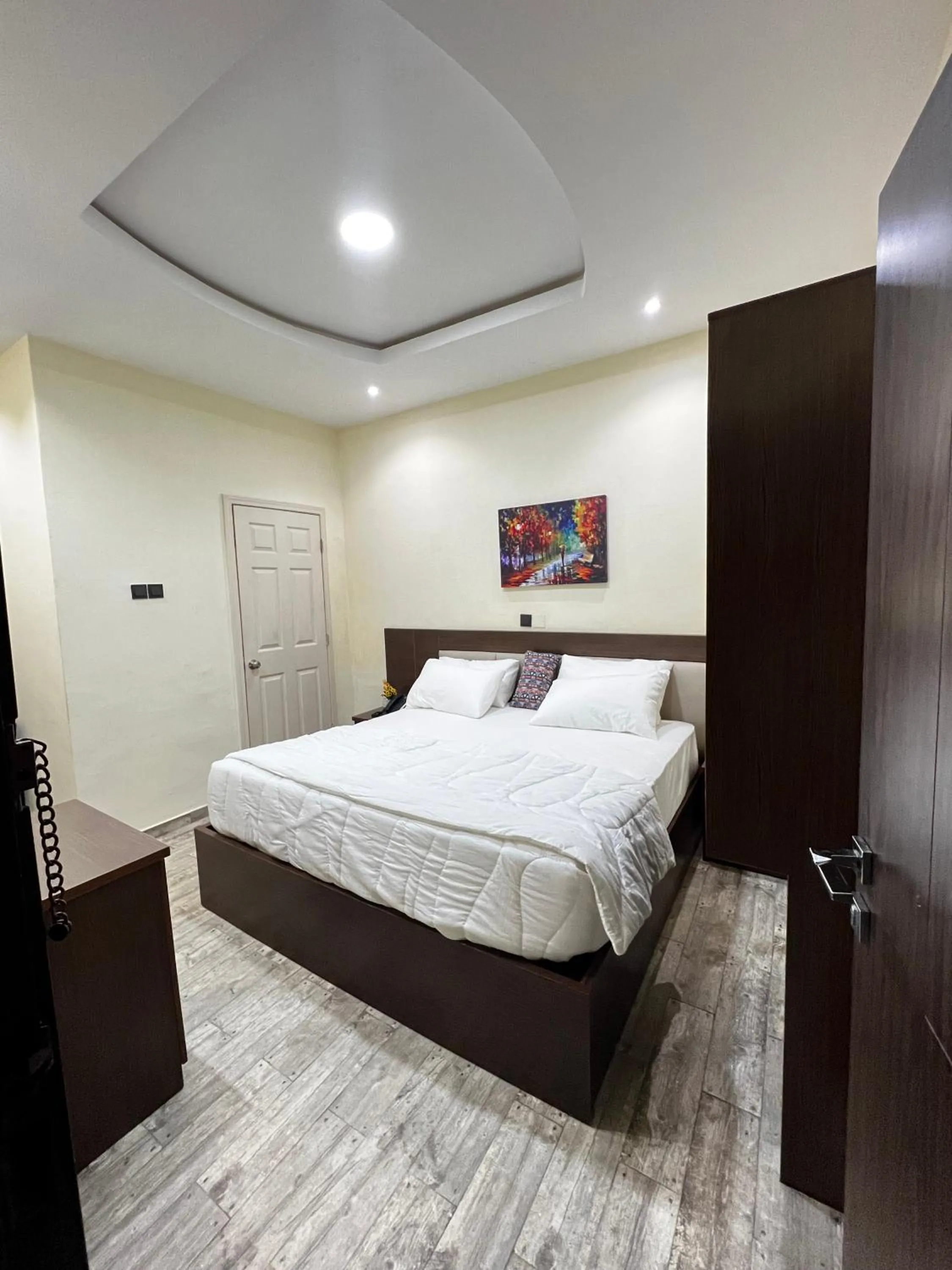 Bed in Fragrance Apartments and Suites