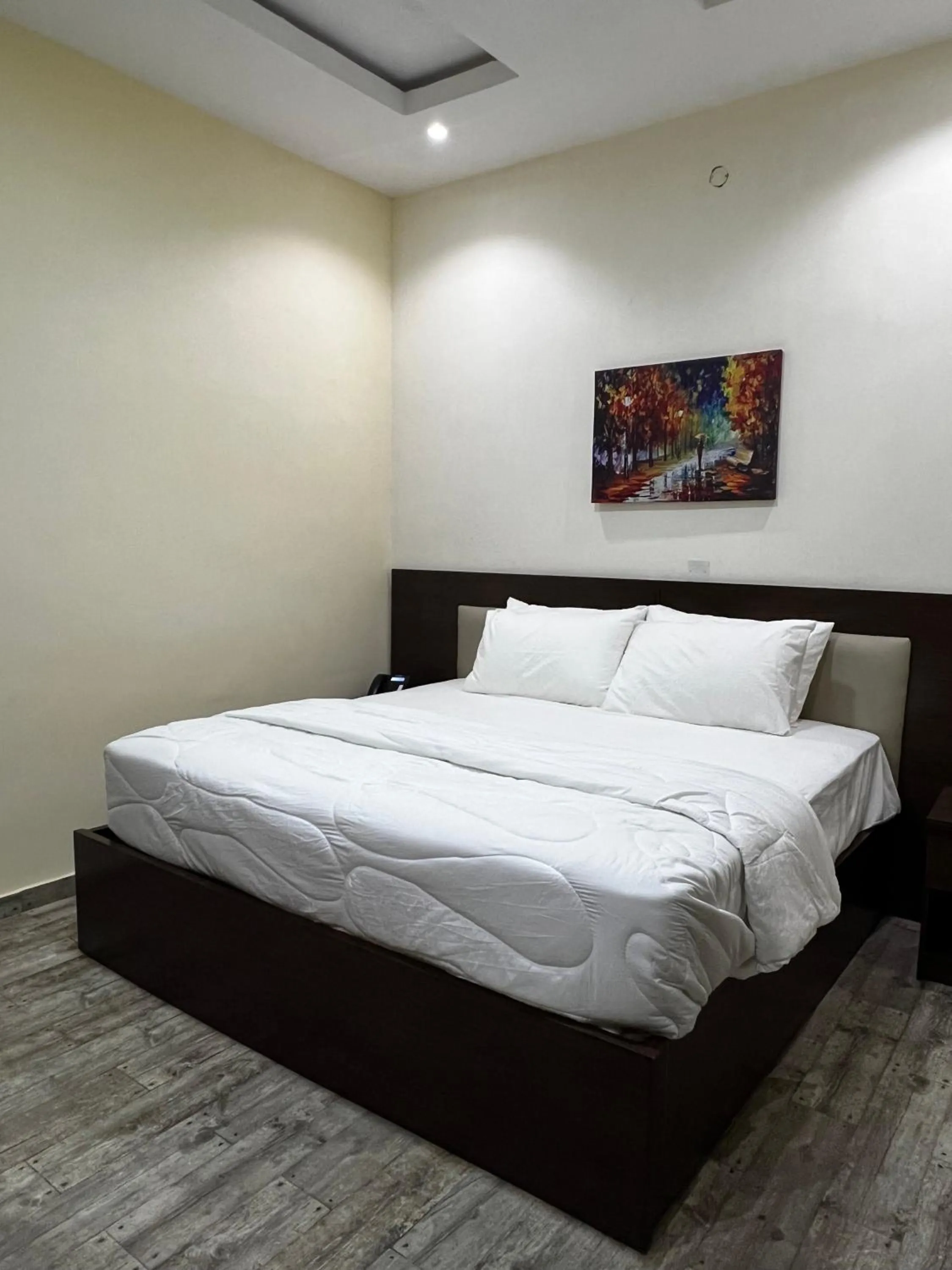 Bed in Fragrance Apartments and Suites