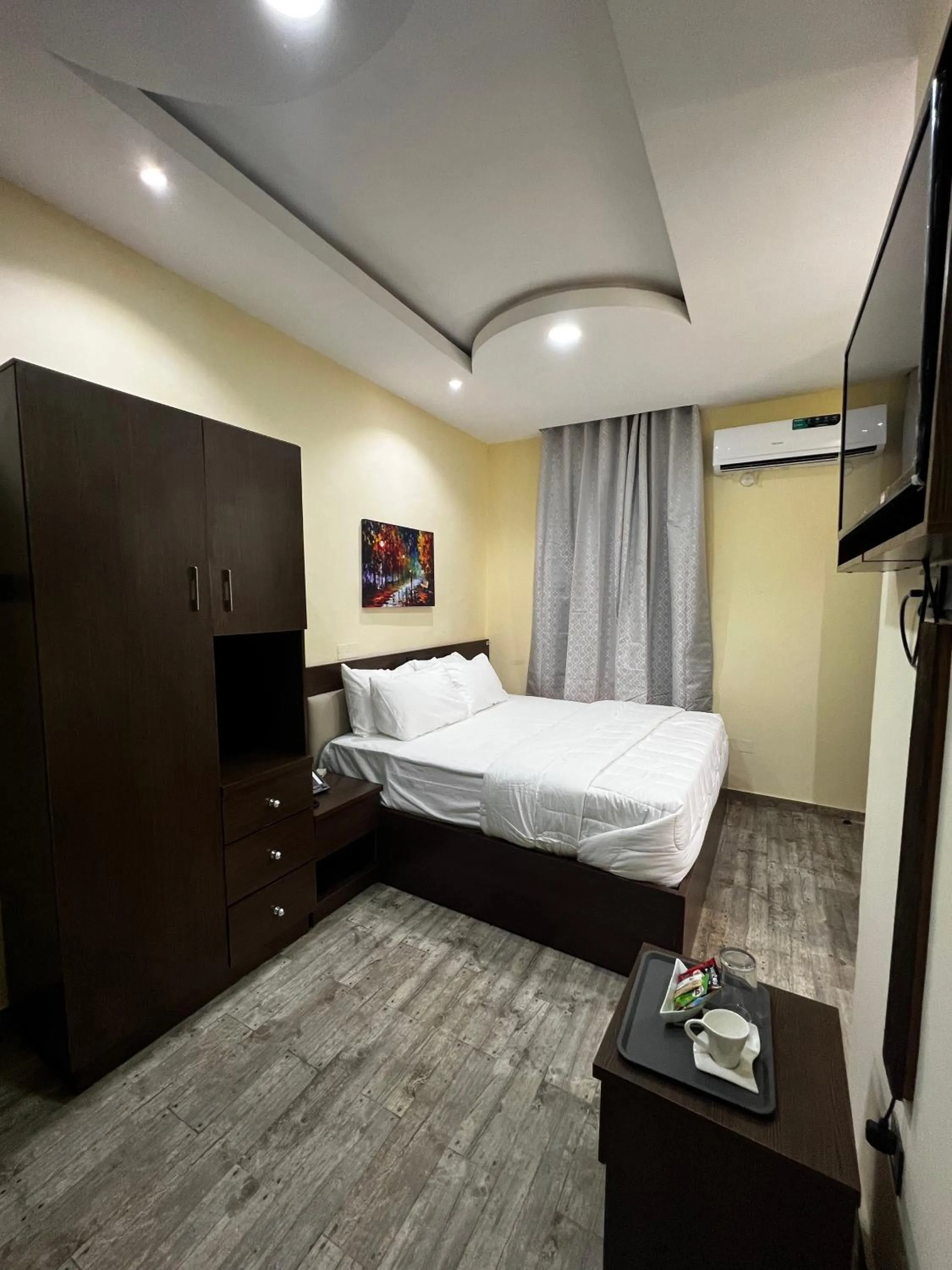 Bed in Fragrance Apartments and Suites