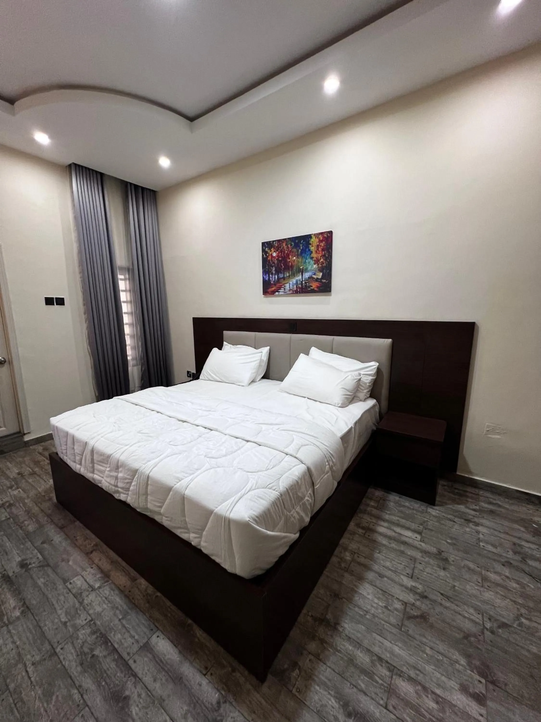 Bed in Fragrance Apartments and Suites