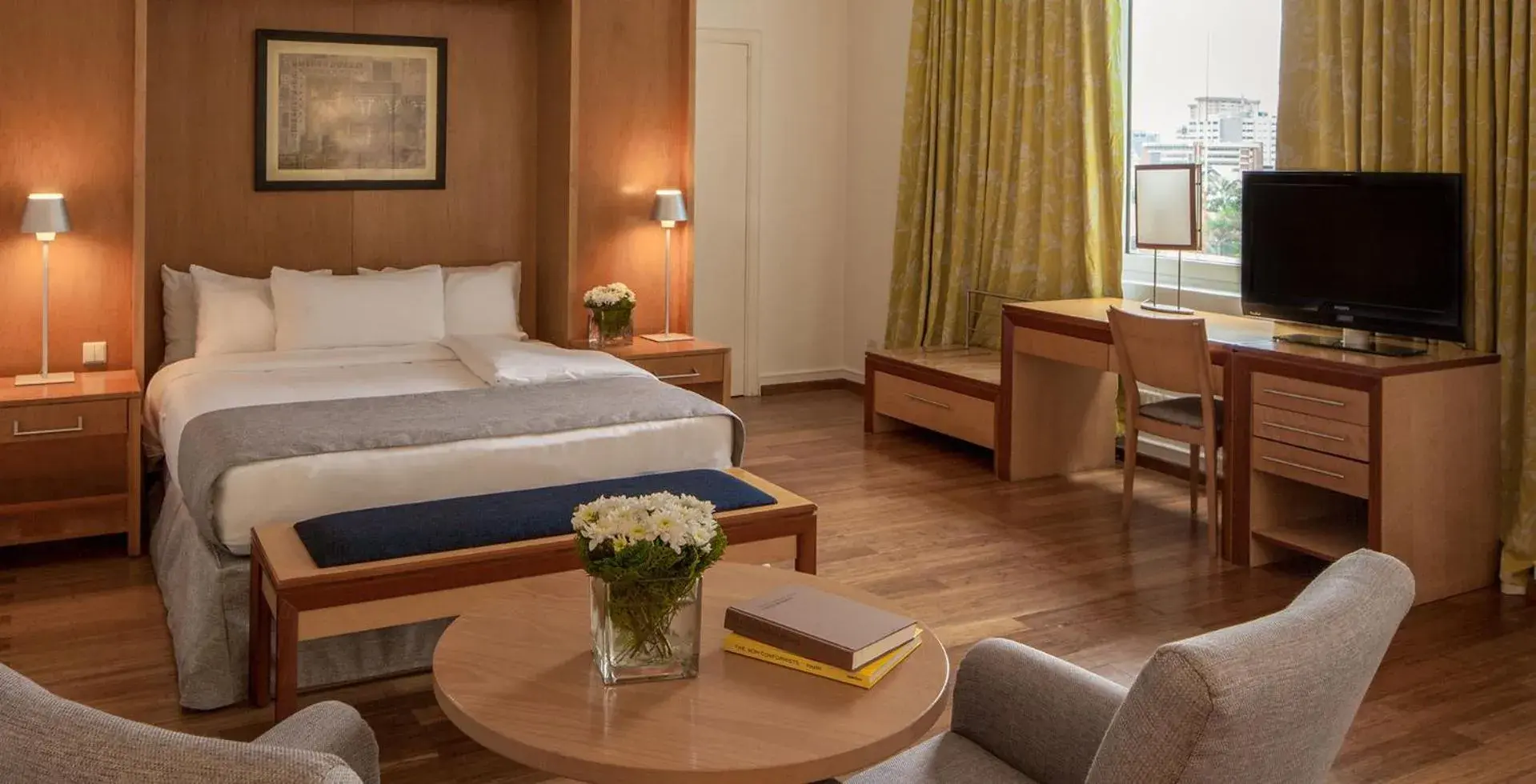 Communal lounge/ TV room, Bed in Eko Hotel Suites Communal lounge/ TV room, Bed in Eko Hotel Suites