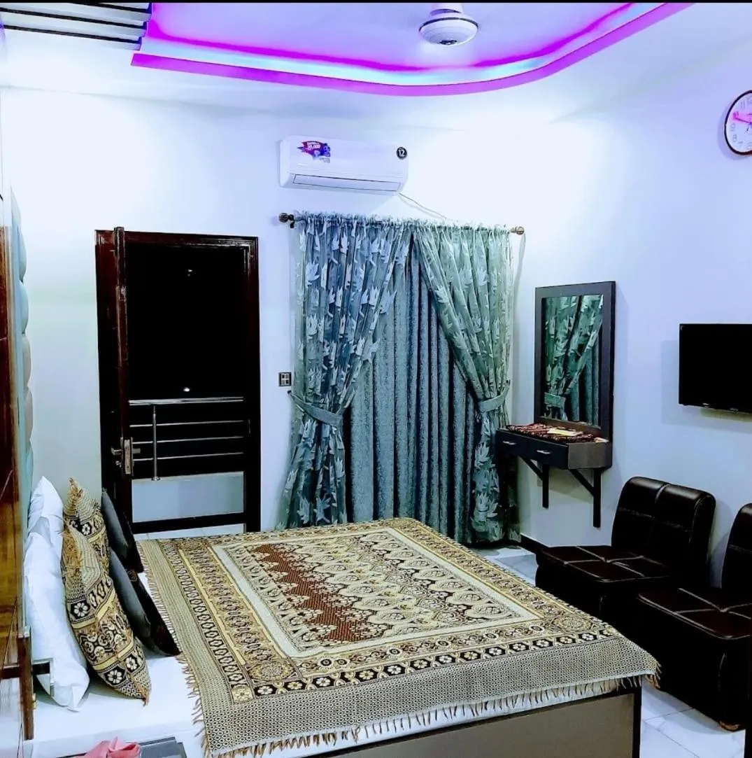 Bed in Galaxy Inn Guest House