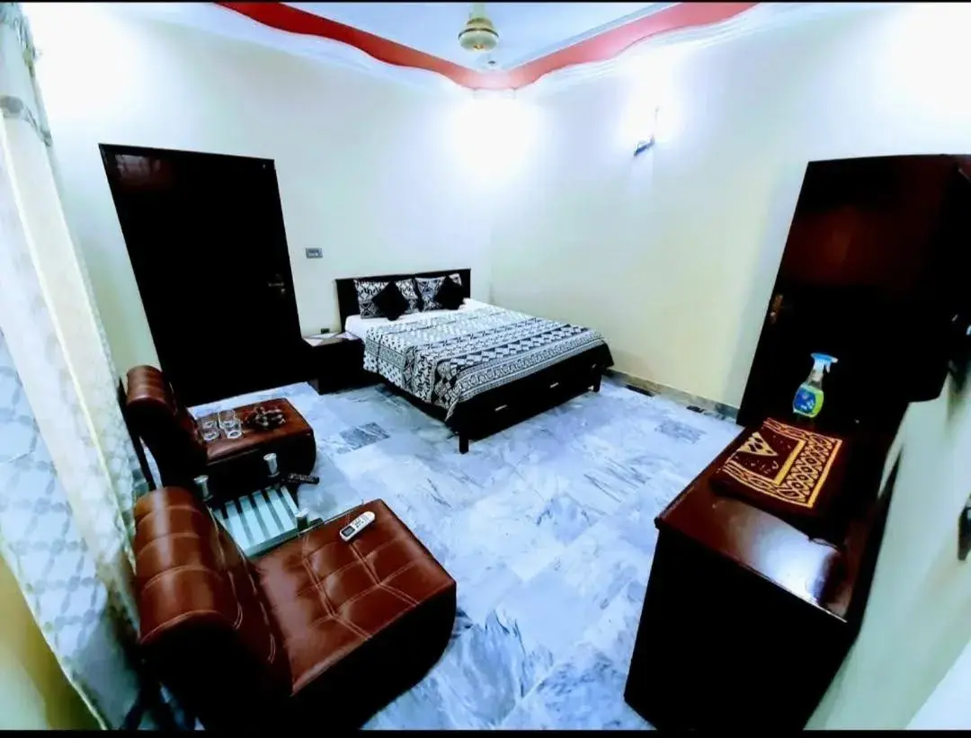 Seating area, Bed in Galaxy Inn Guest House Seating area, Bed in Galaxy Inn Guest House