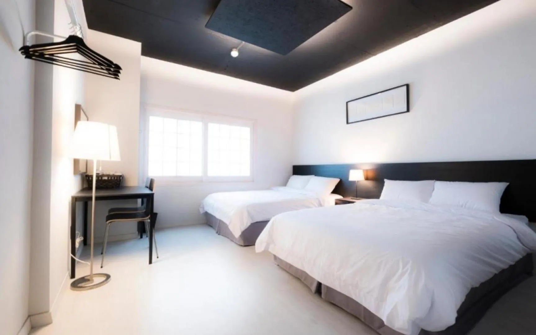 Bed in CANVAS BLACK Guesthouse