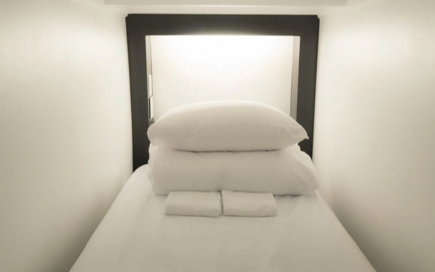 Bed in CANVAS BLACK Guesthouse