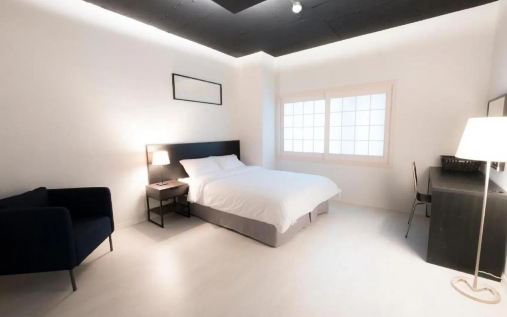 Bed in CANVAS BLACK Guesthouse