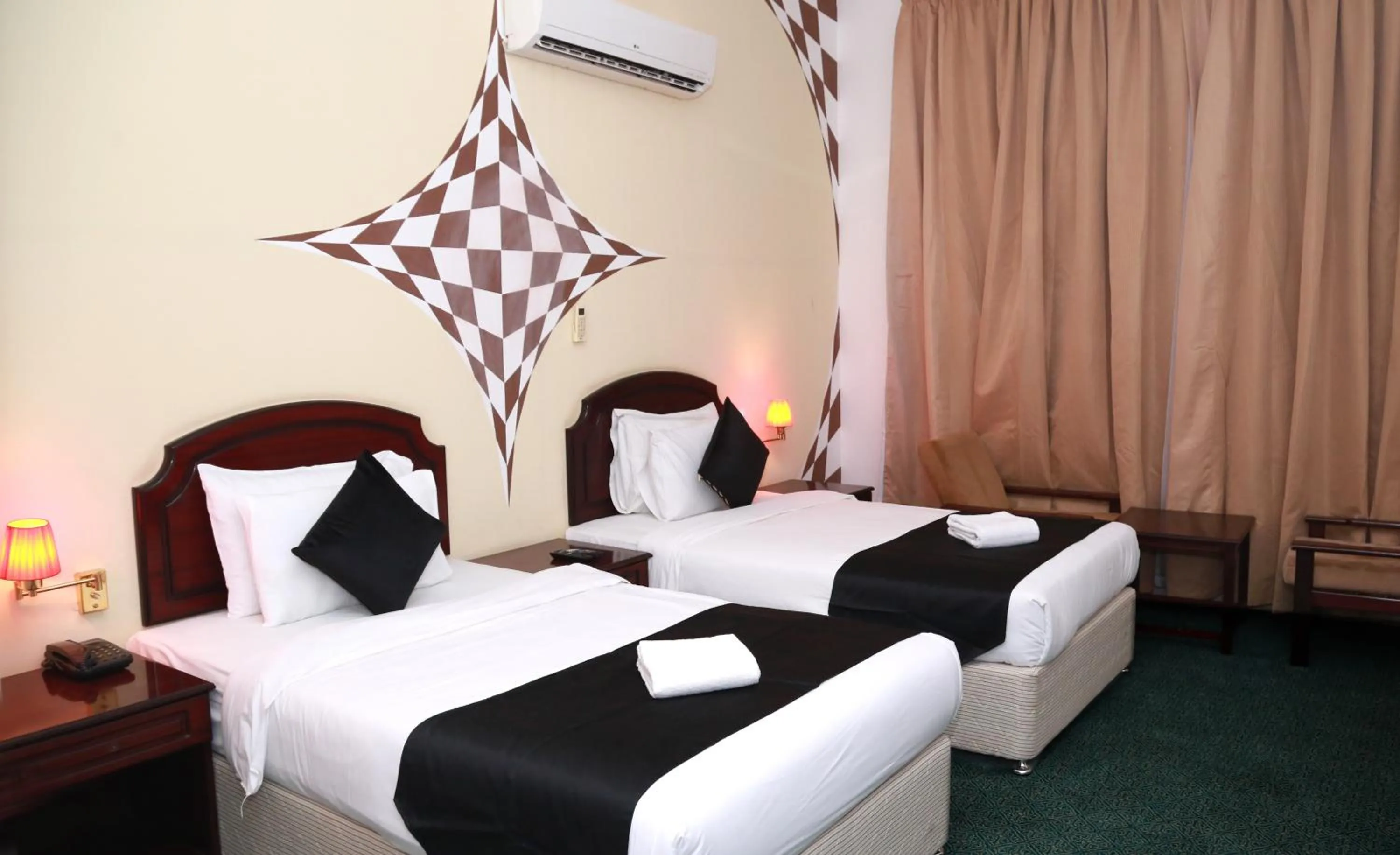 Bed in Ibri Oasis Hotel