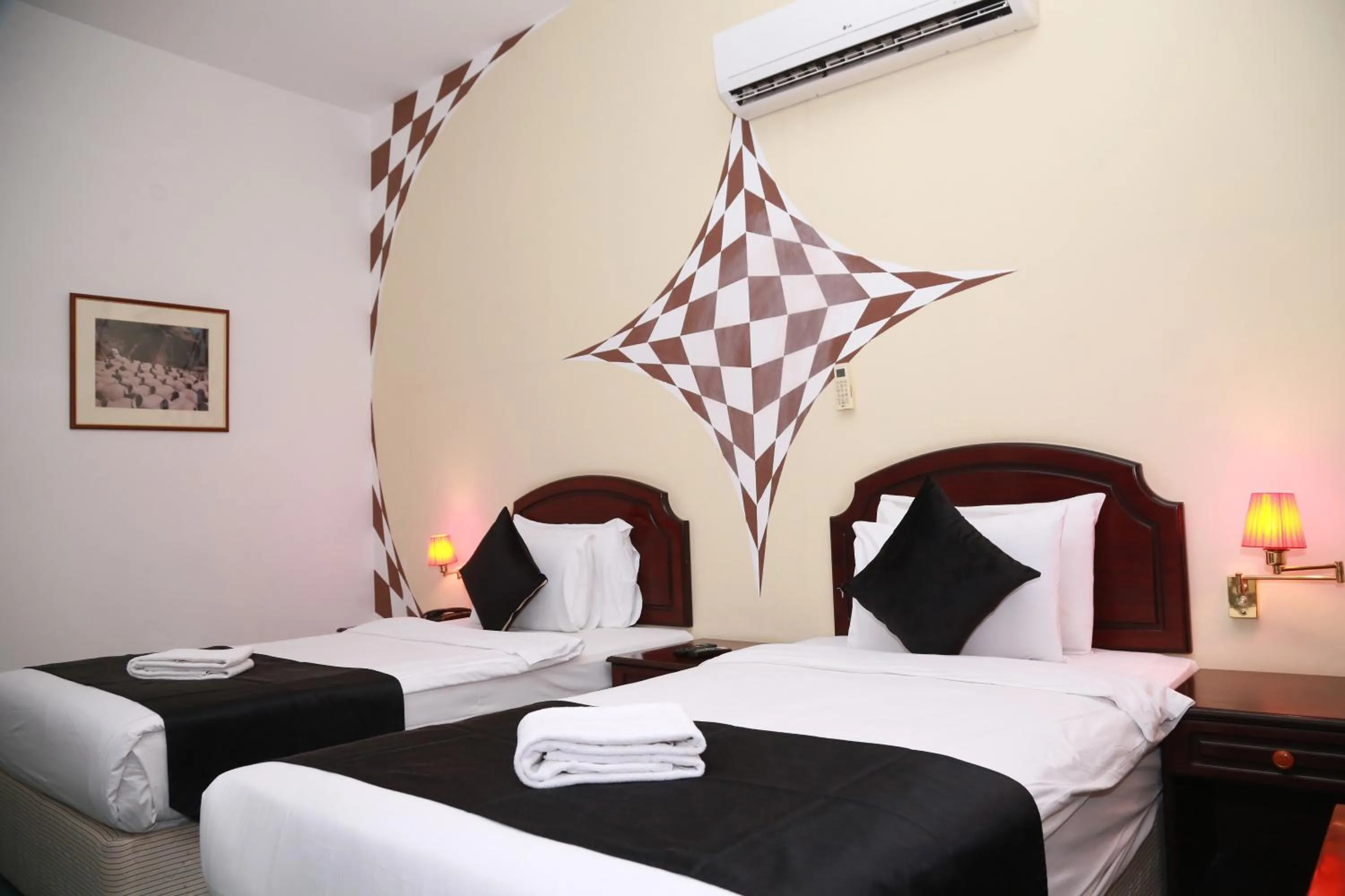 Bed in Ibri Oasis Hotel